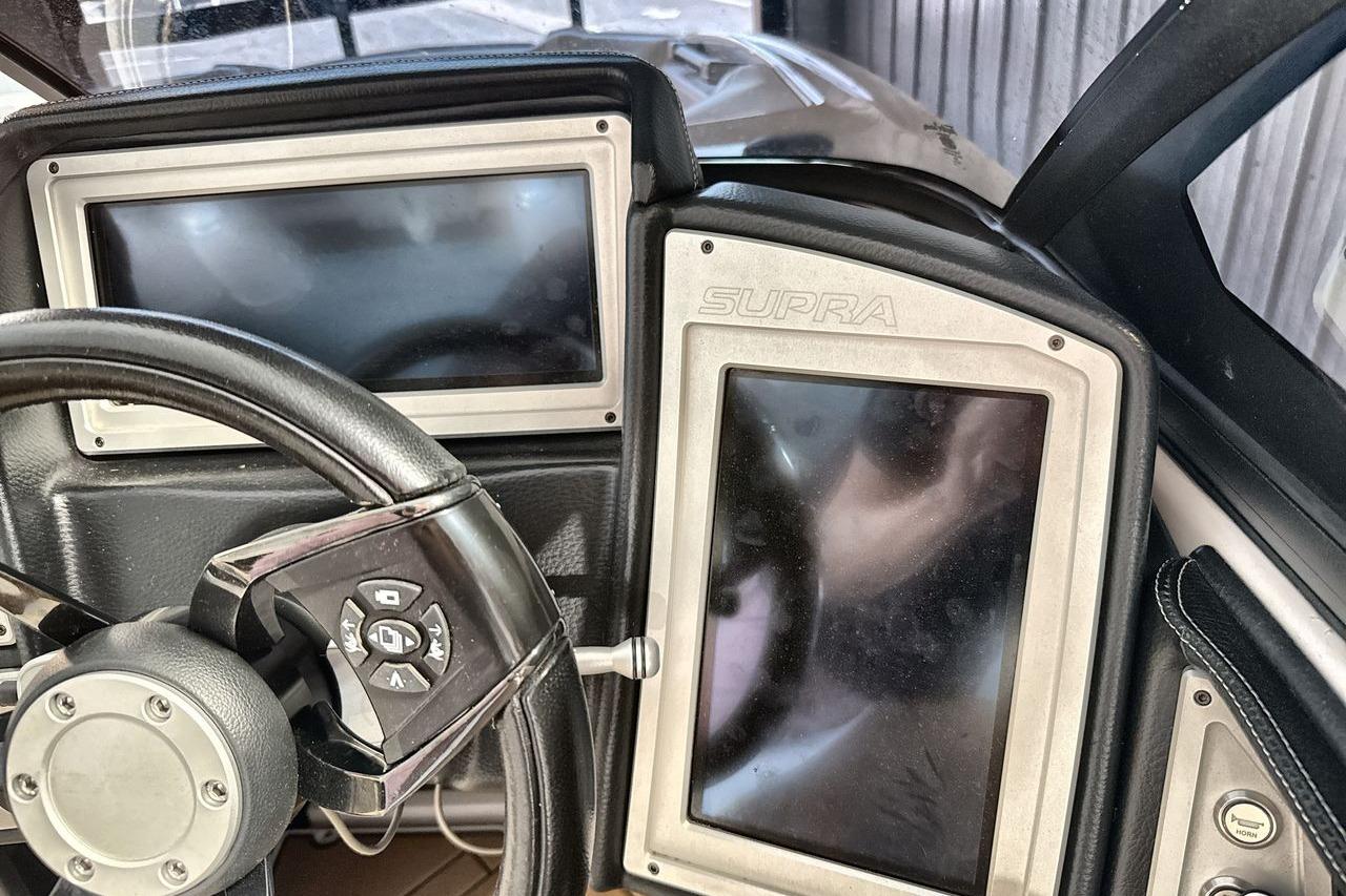 2020 Supra SE dashboard with dual screens and steering wheel controls.