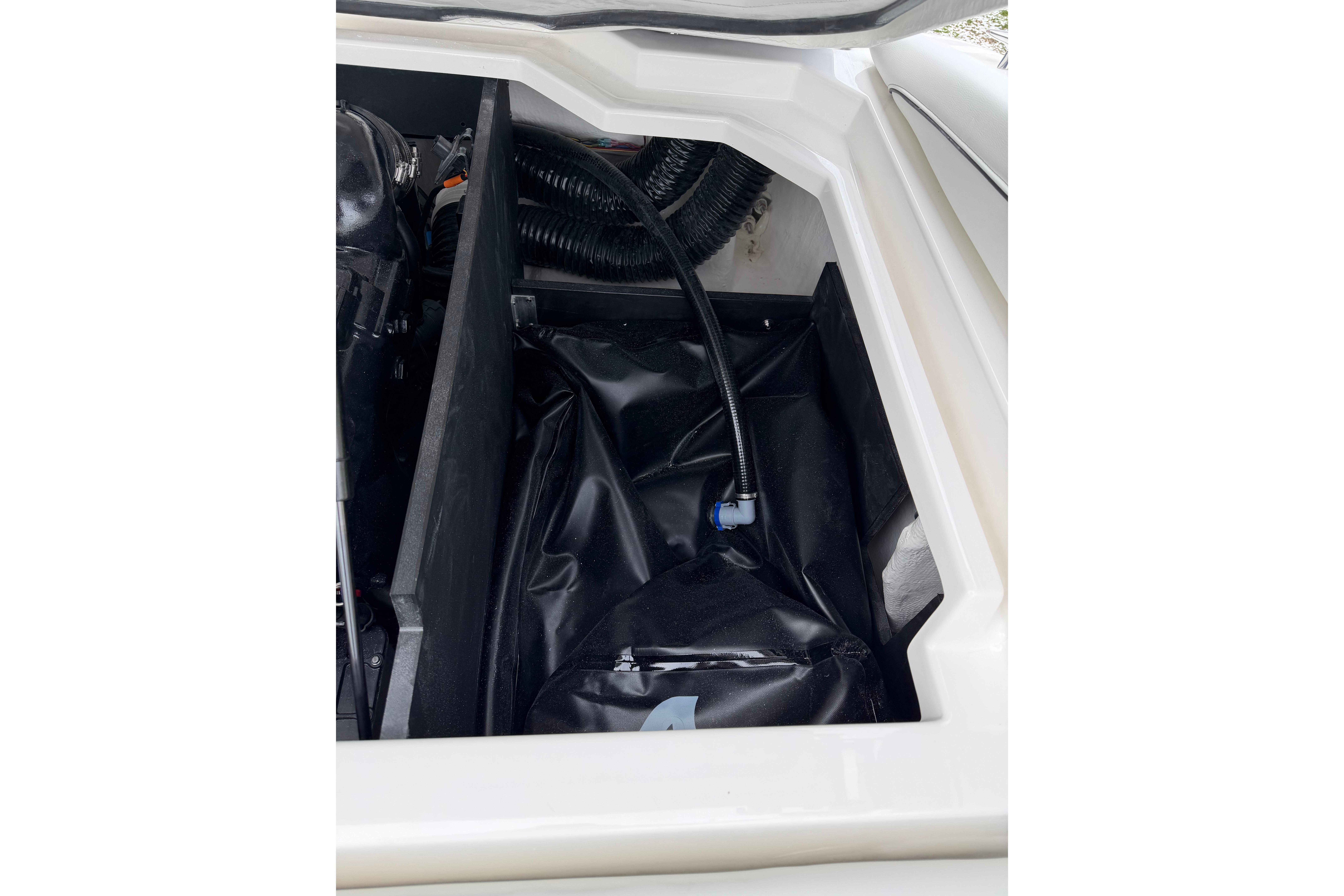 2026 Regal LS2 Surf boat engine compartment with black tubing and components.
