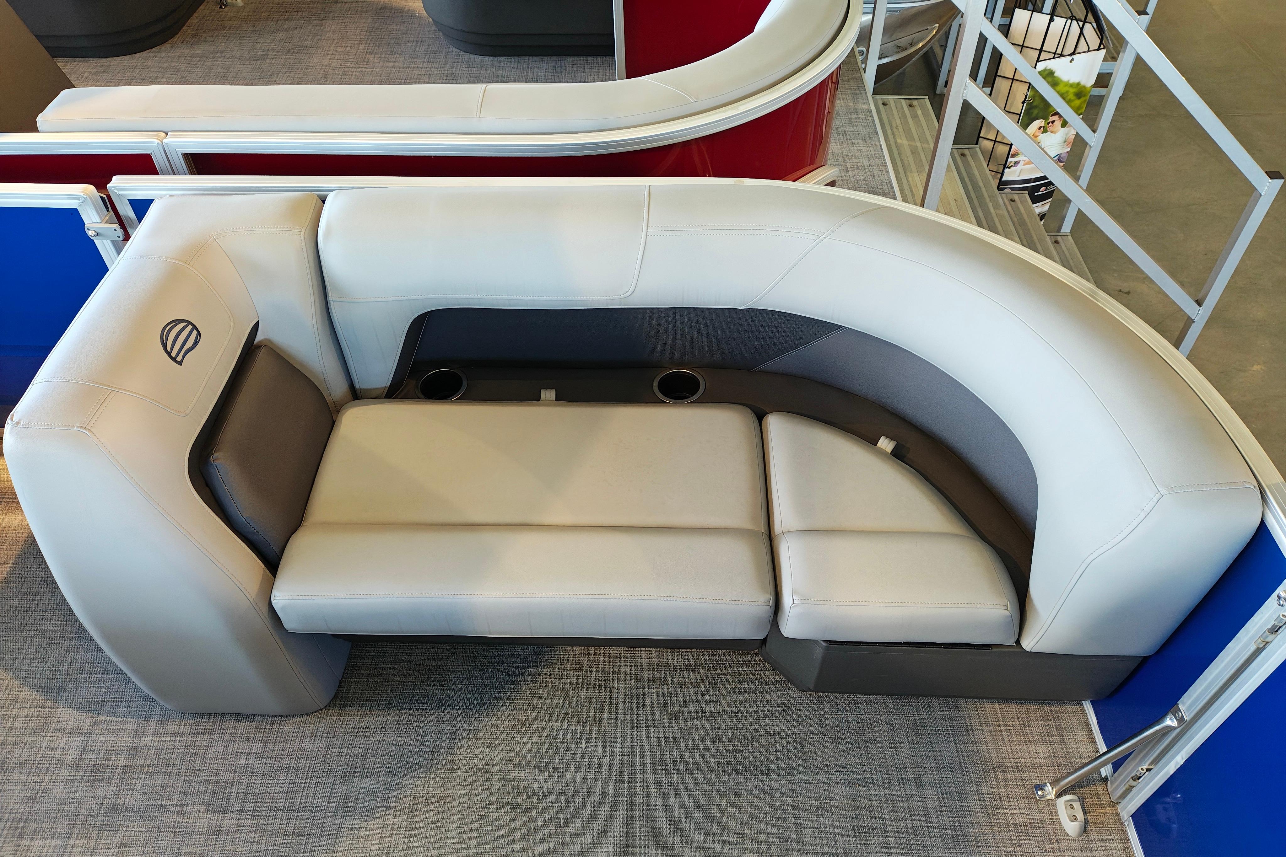 2026 Sun Tracker Party Barge 18 DLX interior seating with cup holders and modern design.