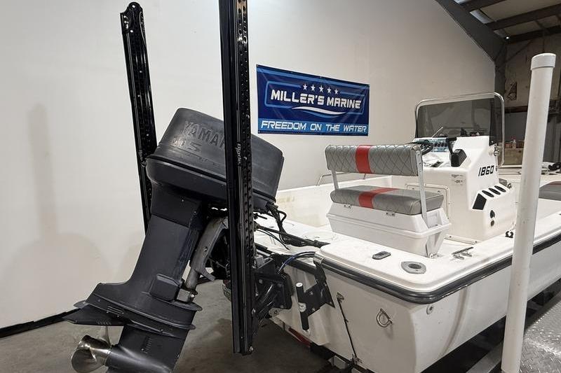 1996 Century 1800 Center Console boat with Yamaha outboard motor in showroom.
