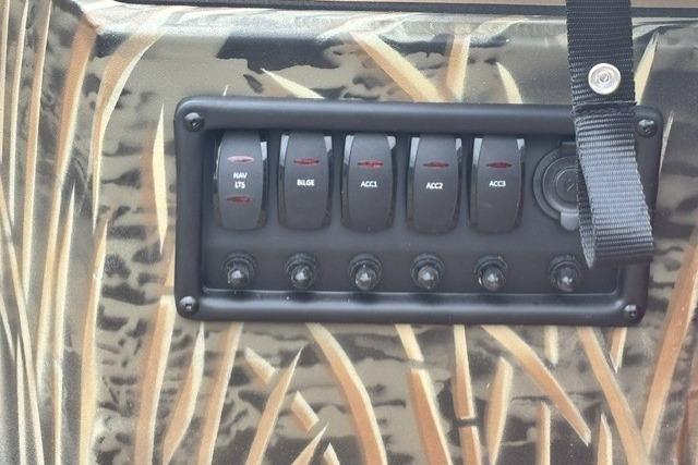 Control panel of 2026 Tracker Grizzly 1650 T Prairie Wings Edition with camo design.