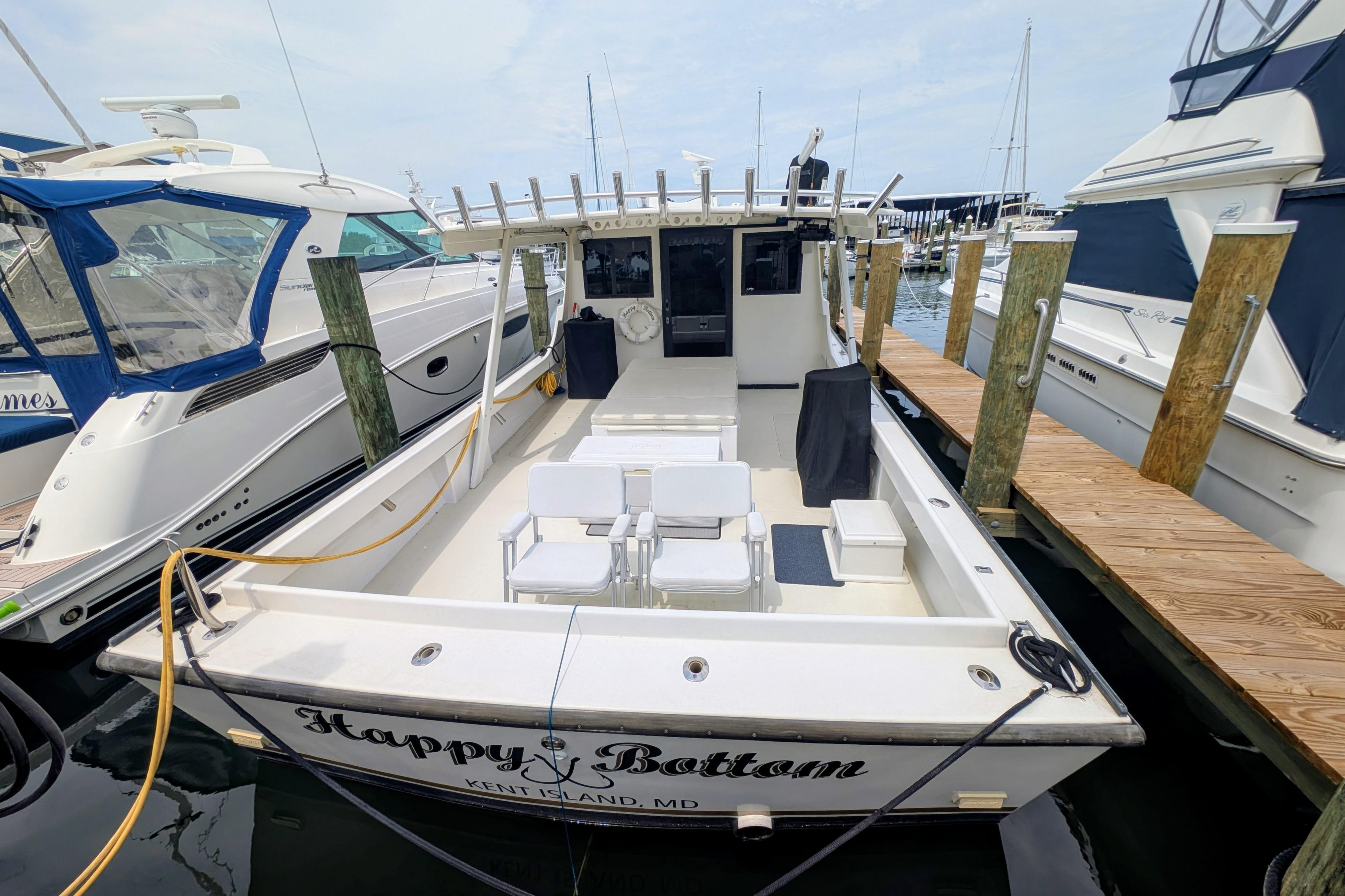 1998 Markley 46 boat docked at marina, named "Happy Bottom," Kent Island, MD.