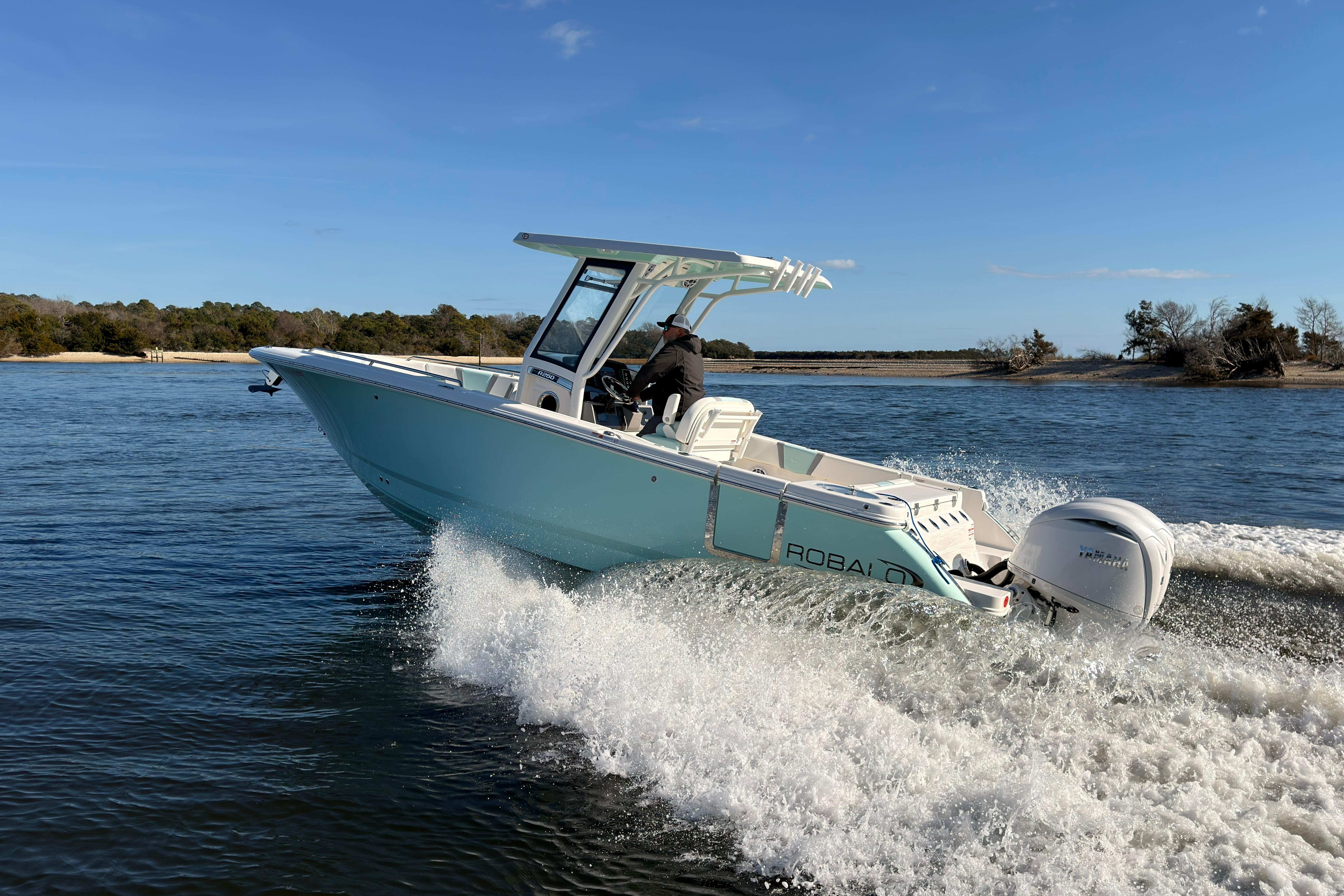 2025 Robalo R250 Center Console boat cruising on open water.