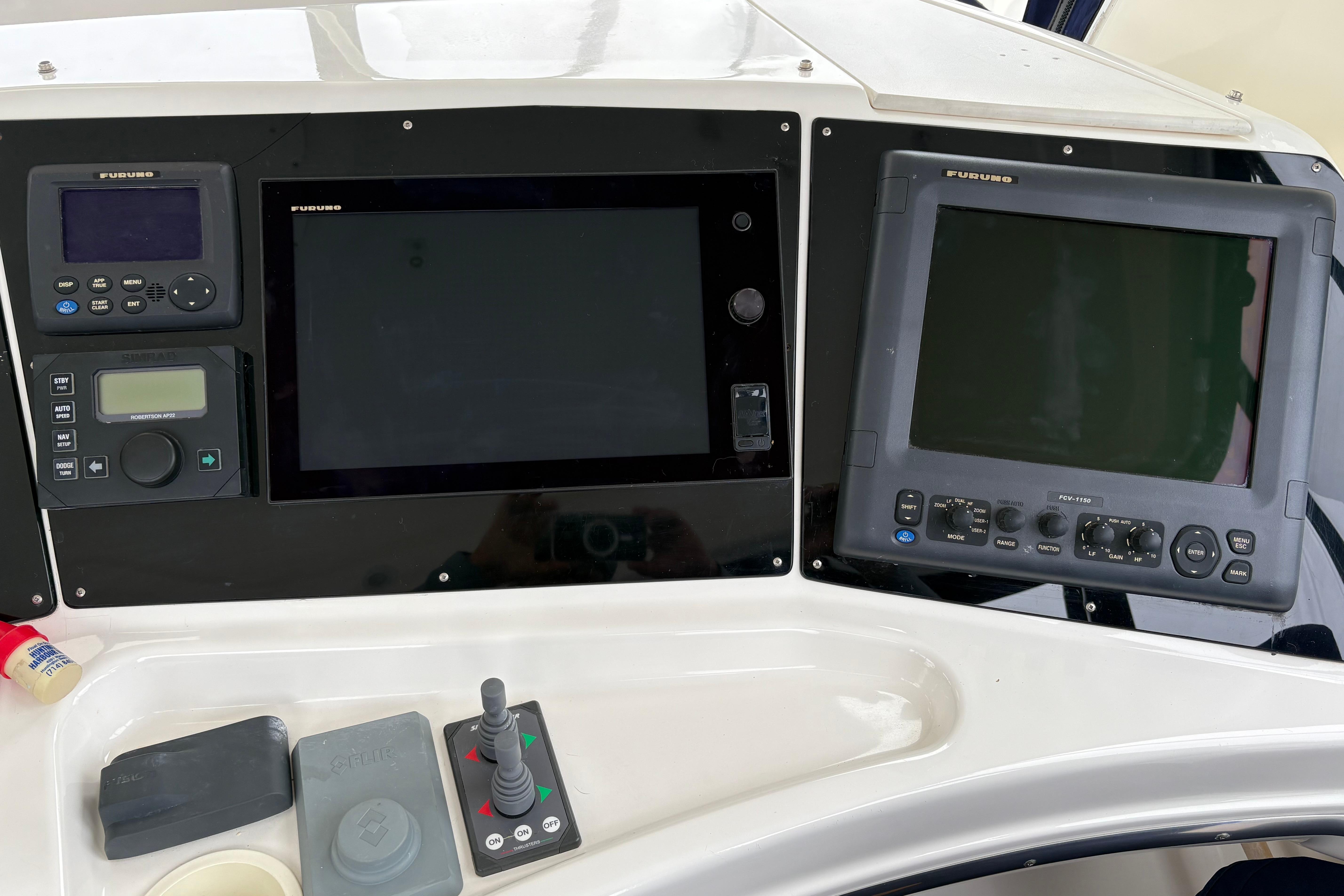 Control panel of a 2000 Silverton 42 Convertible boat with navigation equipment.