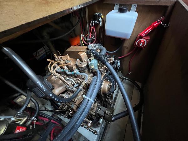 1983 O'Day 34 engine compartment with visible wiring and hoses.
