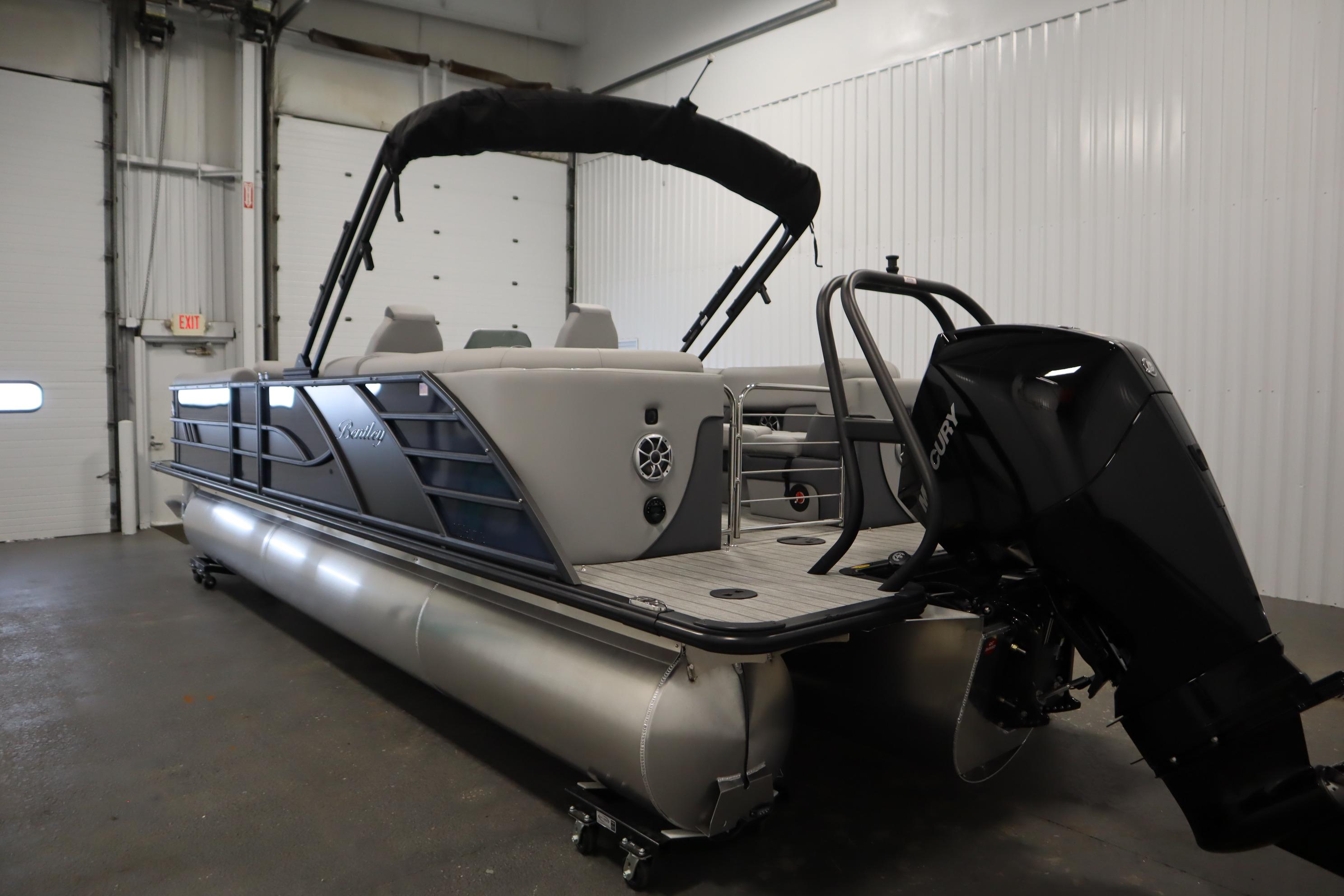 2025 Bentley Pontoons Elite 253 Admiral Tri-toon in indoor storage, showcasing sleek design.