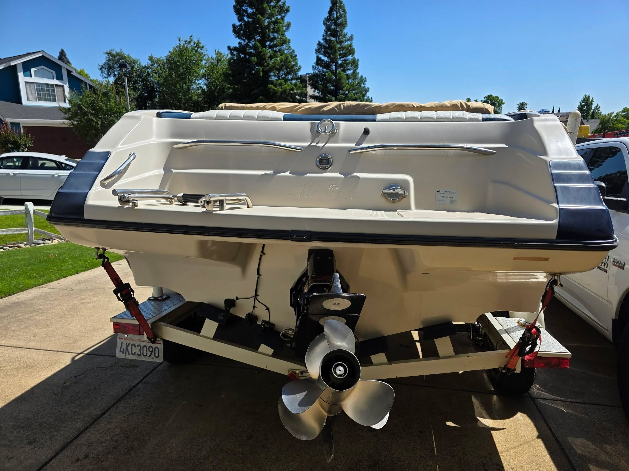 1996 Mariah Talari boat parked on trailer outdoors.
