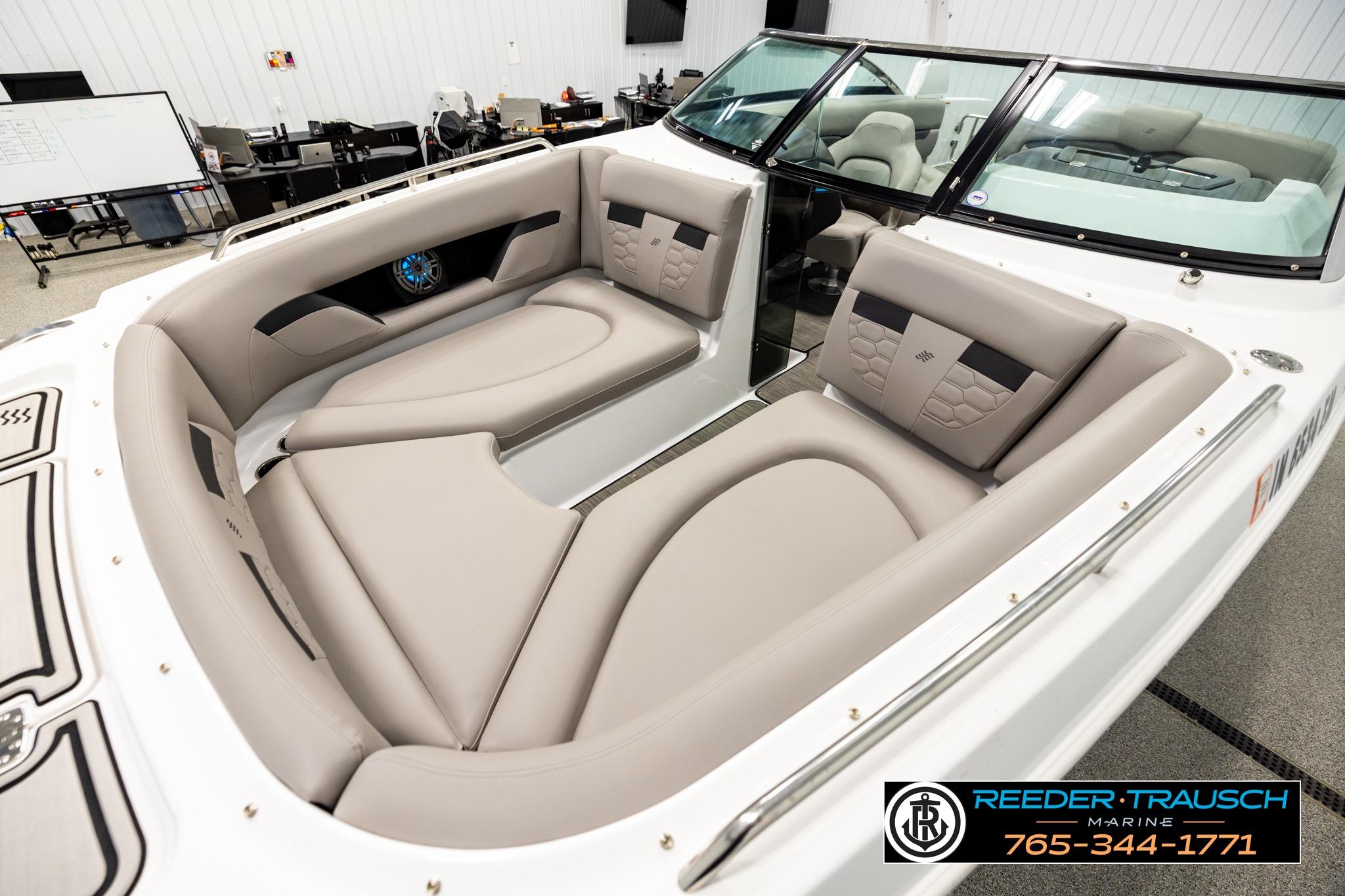 2024 FOURWINNS HD5 Surf boat interior with beige seating and modern design.