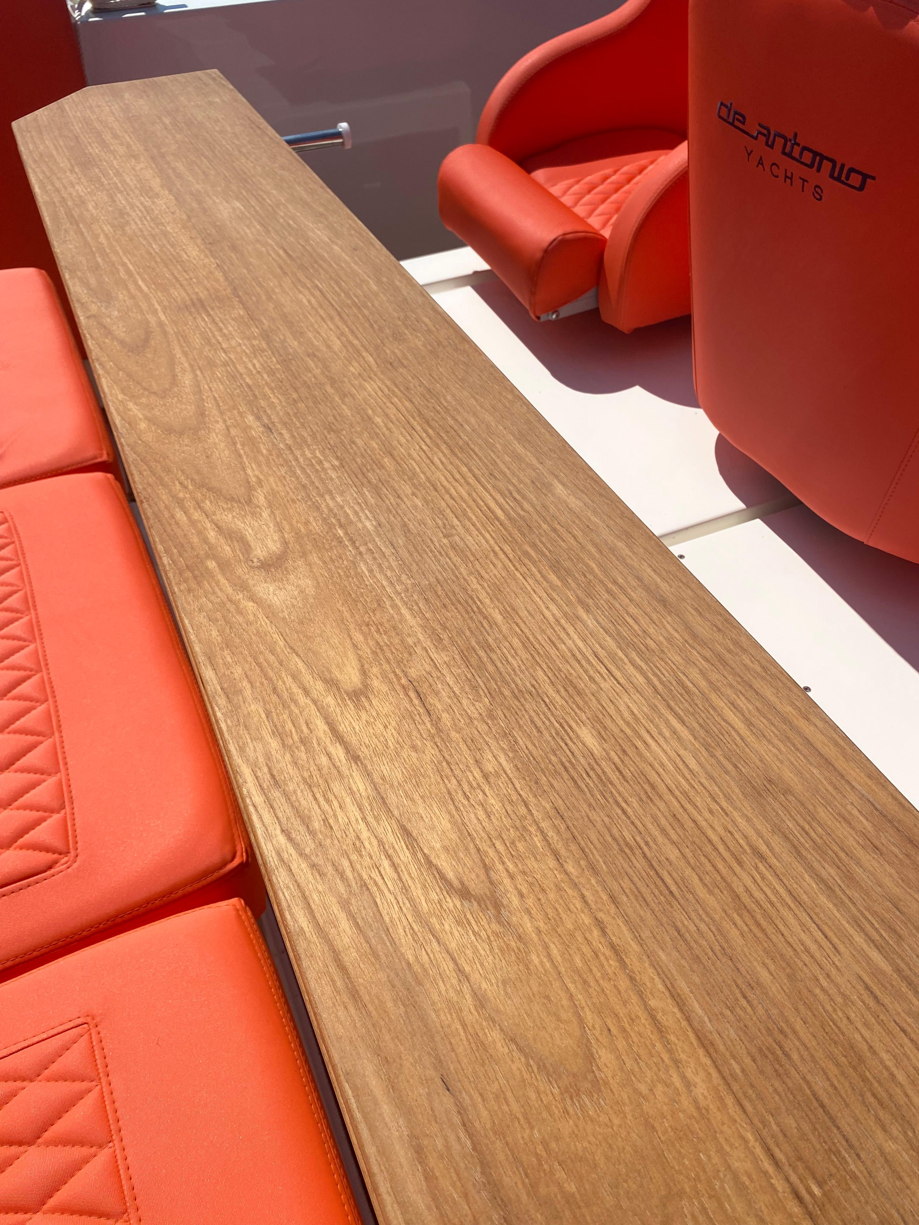 De Antonio Yachts D 28 2020 model with wooden table and red seating.