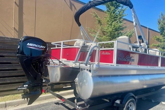 2026 Sun Tracker Bass Buggy 18 DLX pontoon boat with Mercury outboard motor.
