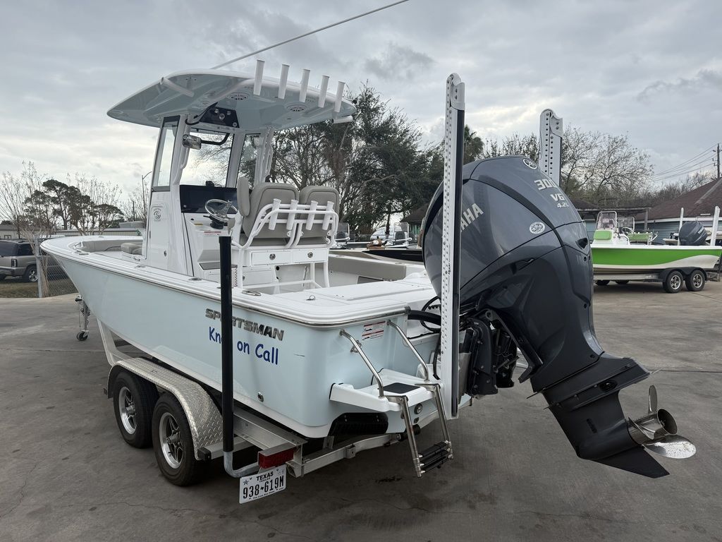 A 2025 Sportsman Masters 247OE Bay Boat on a trailer. It features a large outboard motor.