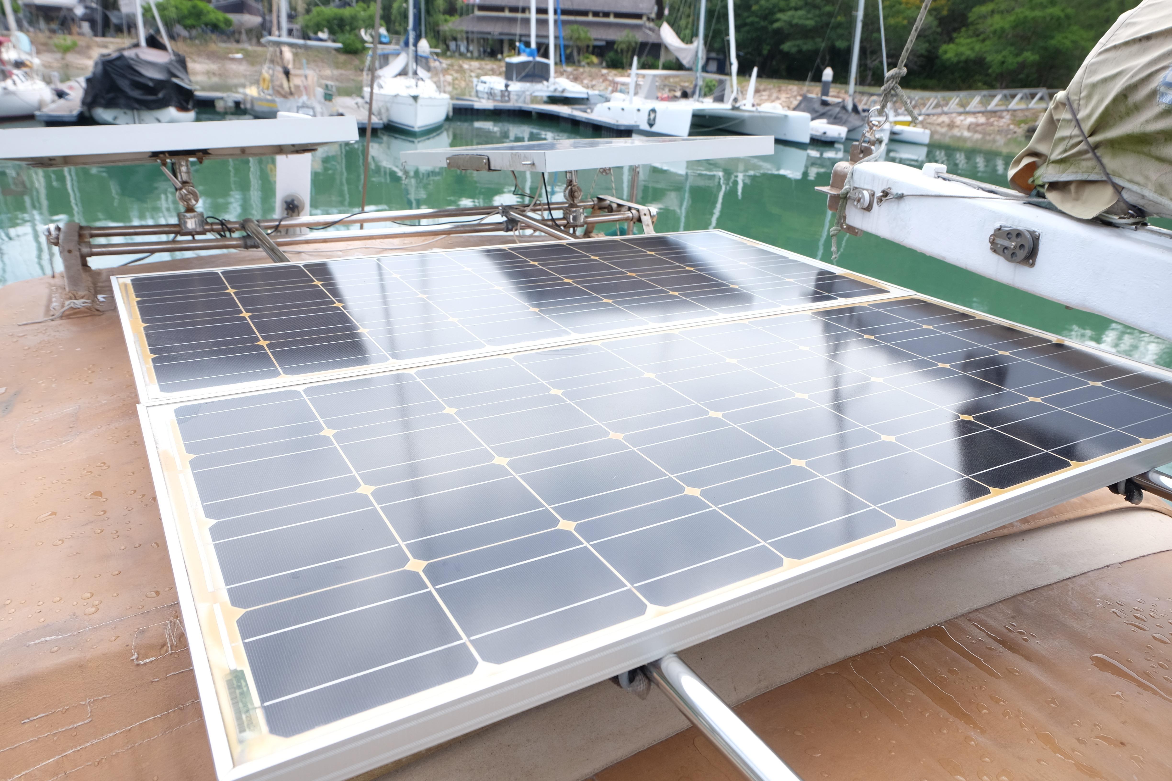 Solar panels on a 1979 Westwind 35 boat docked at a marina.