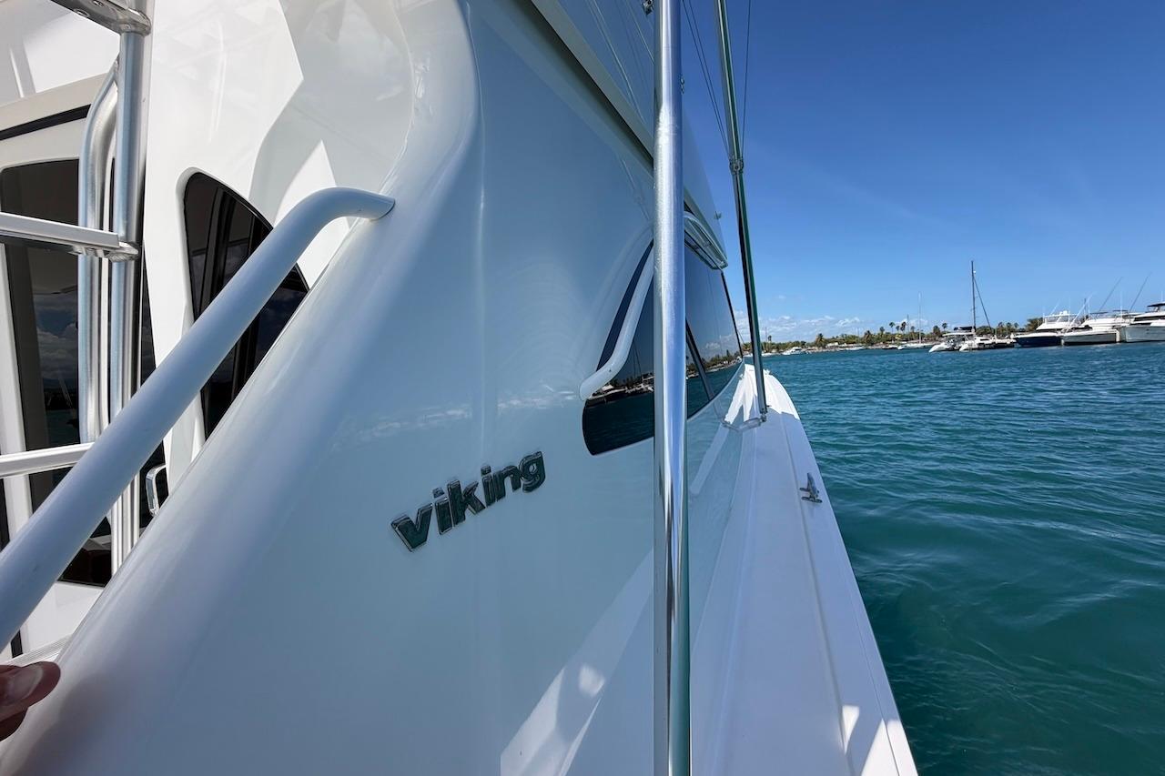 2012 Viking 50 Convertible yacht on calm blue waters, sunny day.