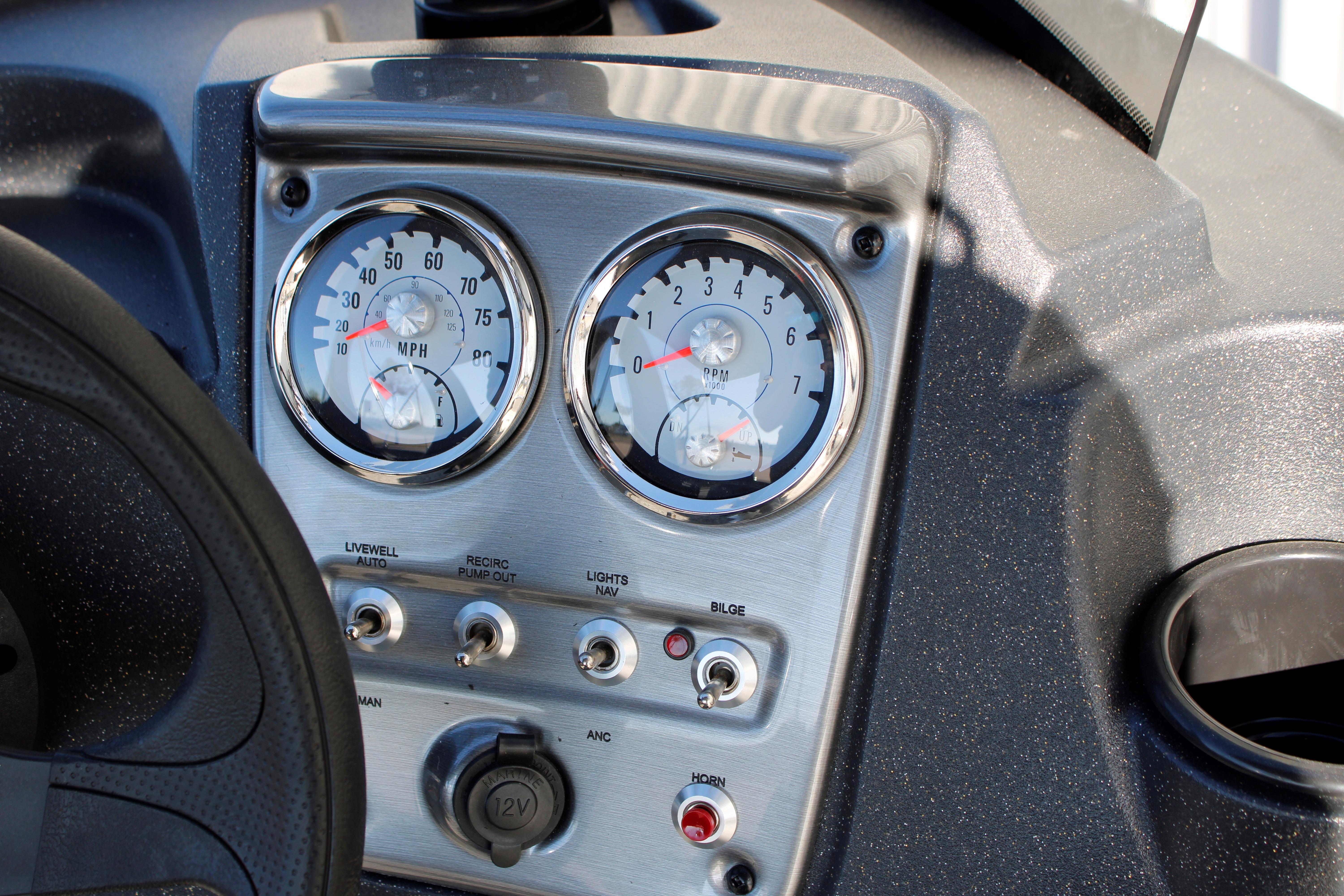 Dashboard of 2026 Tracker Pro Guide V-16 SC boat with gauges and controls.