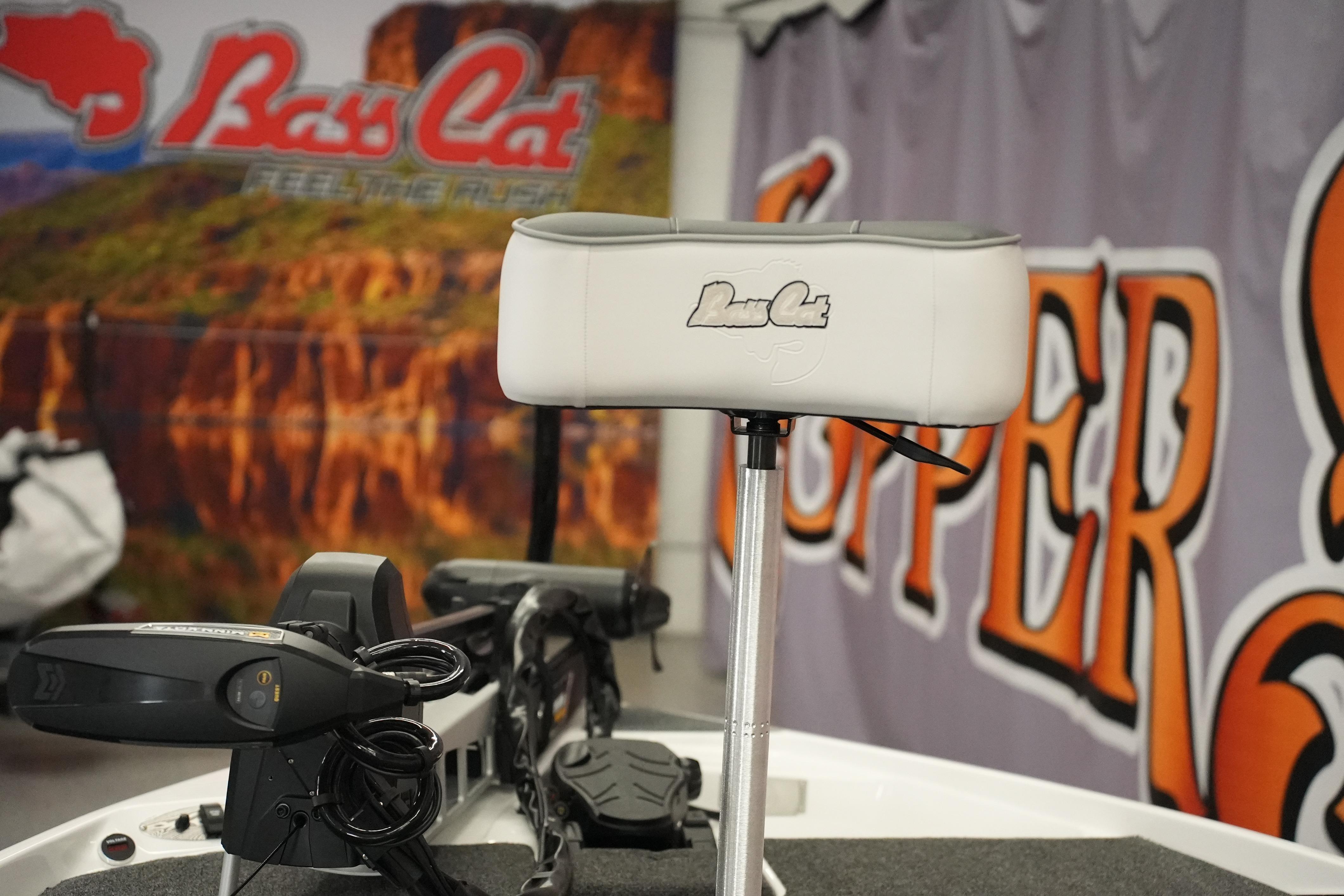 2026 Bass Cat Puma STS boat seat with logo, showcased indoors.