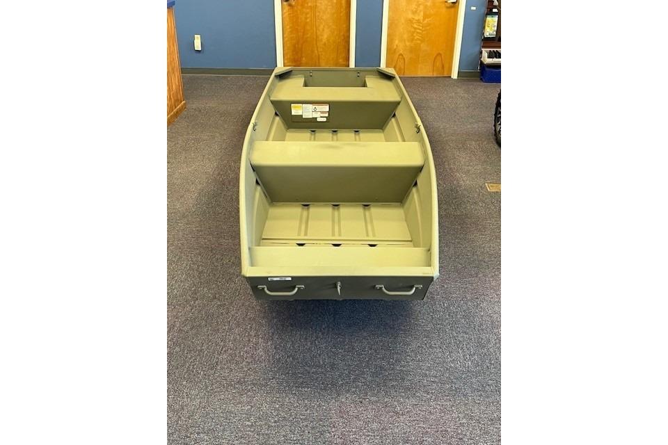2026 Tracker Grizzly 14 Jon boat displayed indoors on carpeted floor.