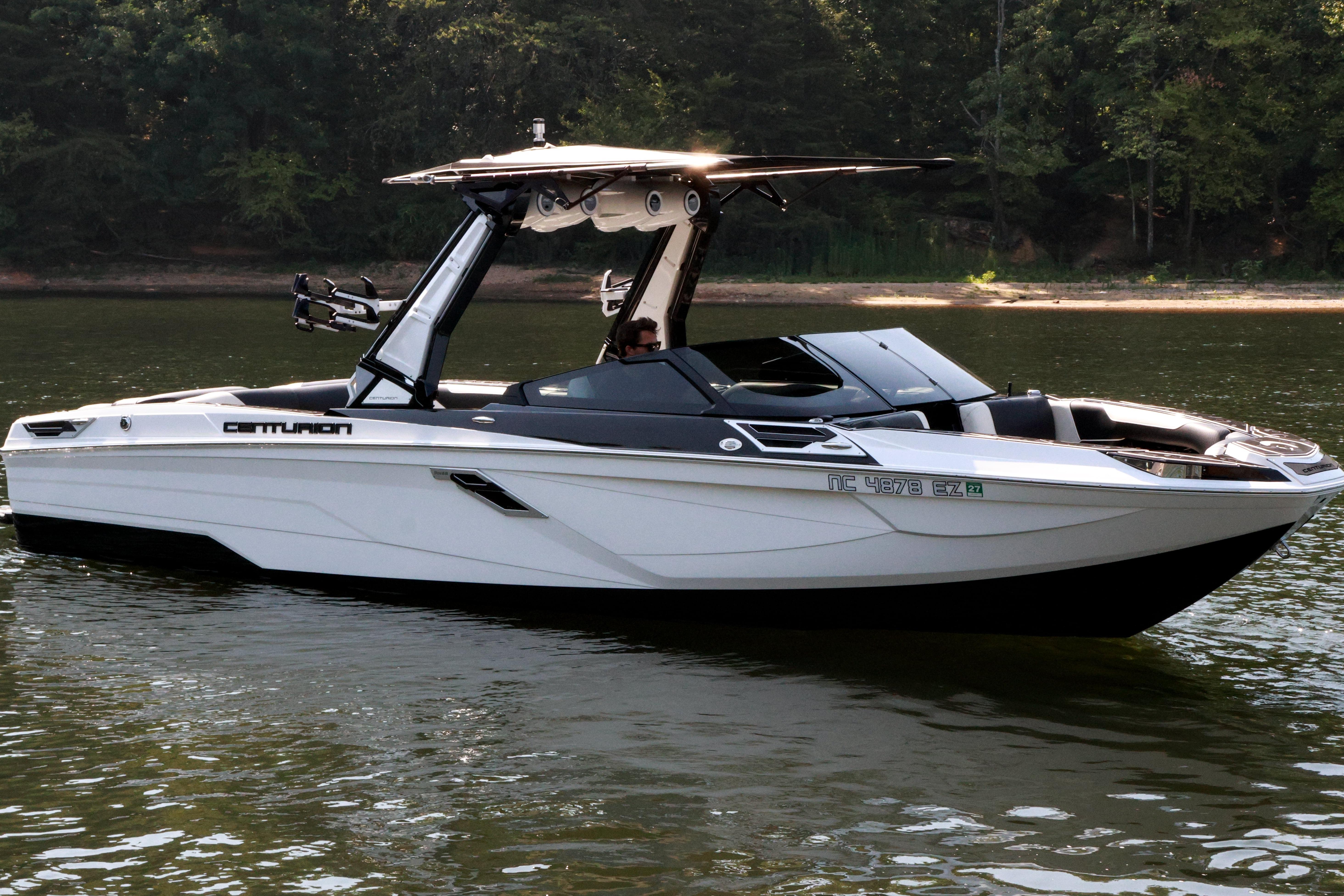 2022 Centurion Ri265 boat on calm water, featuring sleek design and modern amenities.