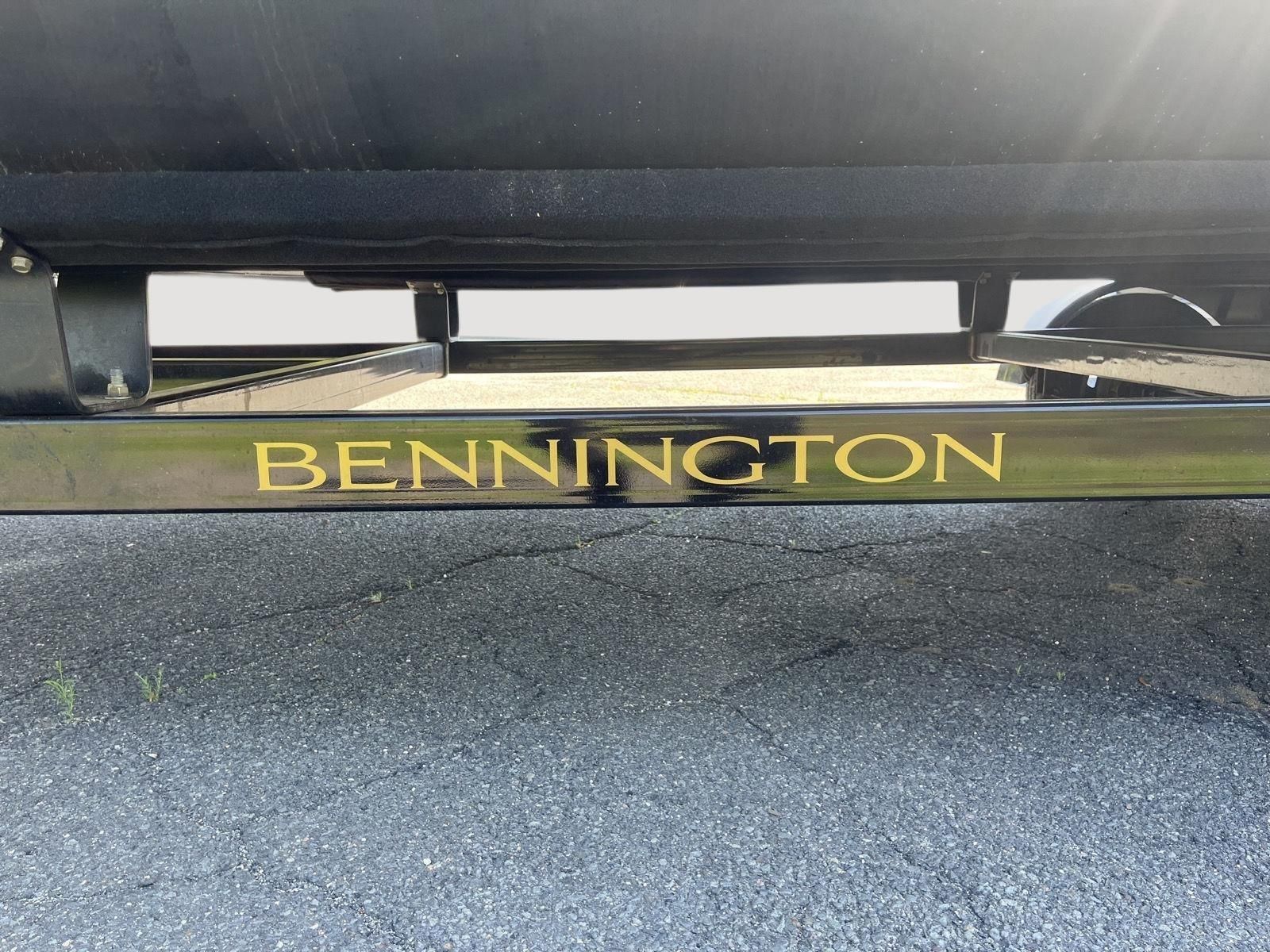 Close-up of the Bennington logo on a boat trailer.