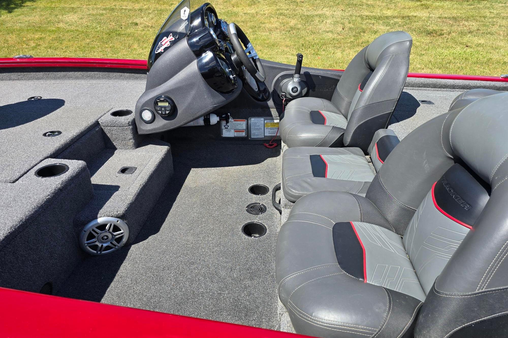 2021 Tracker Pro Team 175 TXW boat interior with steering console and seating.