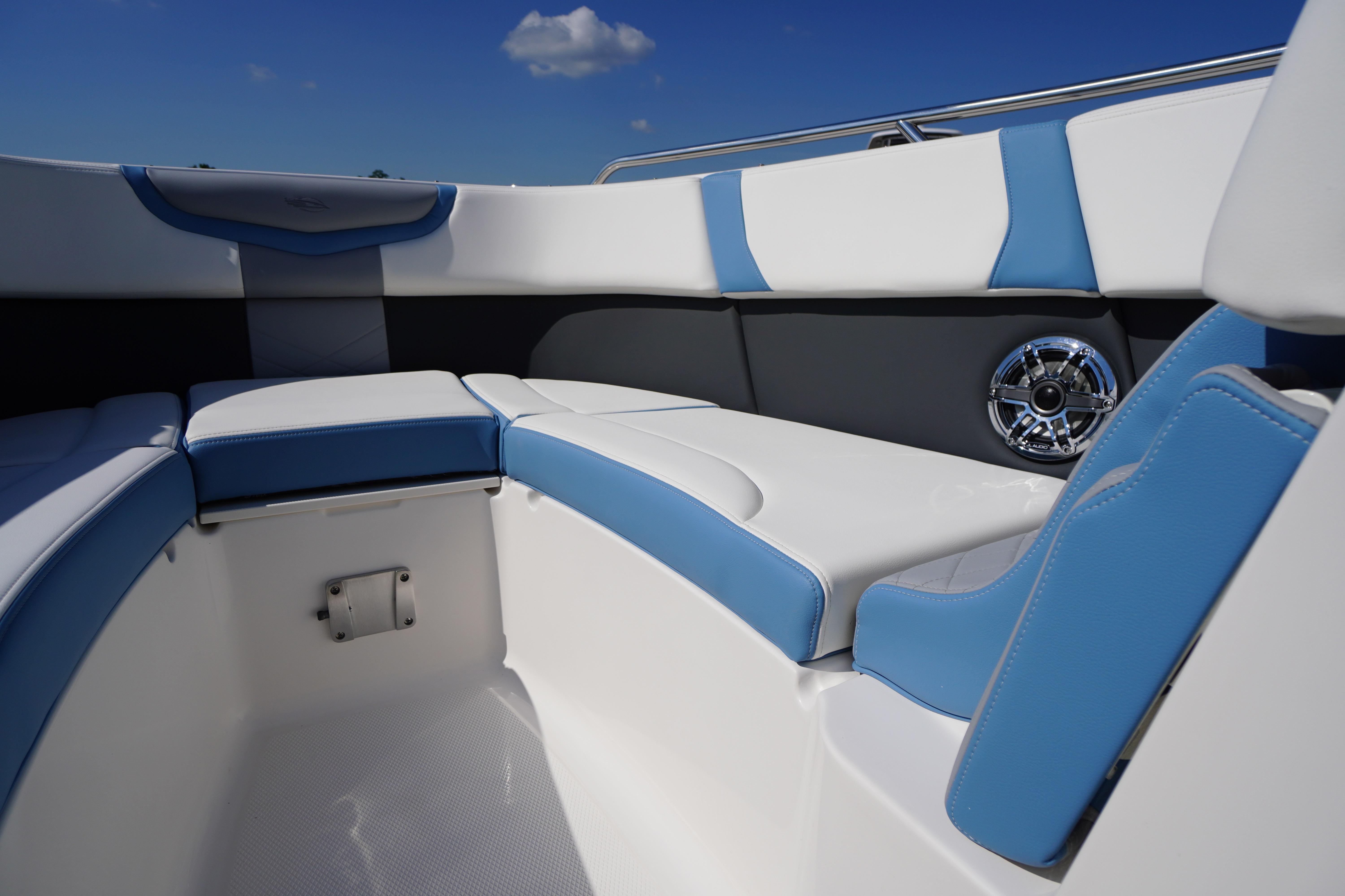 Interior seating of 2026 Chaparral 270 OSX boat with blue and white upholstery.
