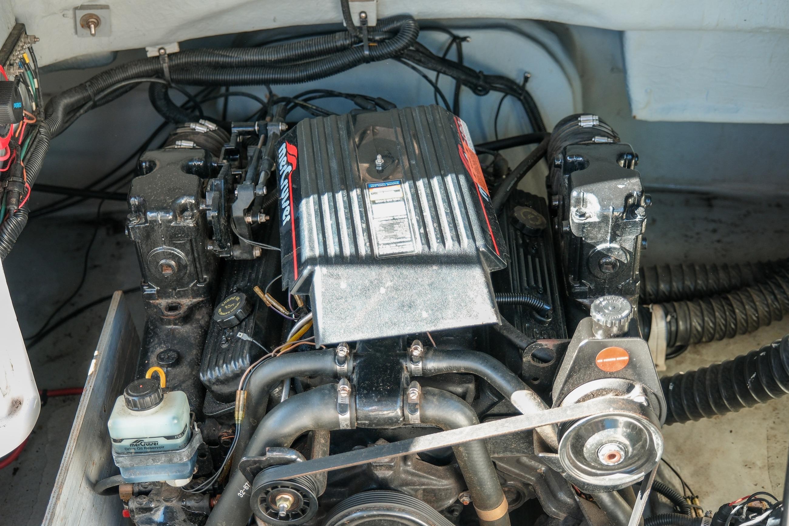 Engine compartment of a 1998 Chaparral 232 Sunesta boat, featuring a MerCruiser engine.