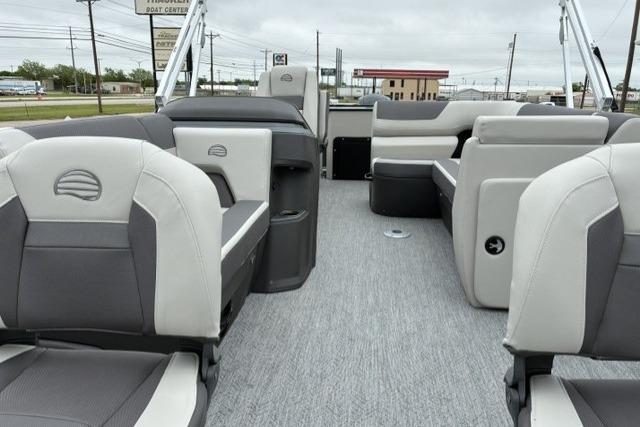 2026 Sun Tracker Fishin' Barge 22 DLX interior with gray seating and open deck layout.