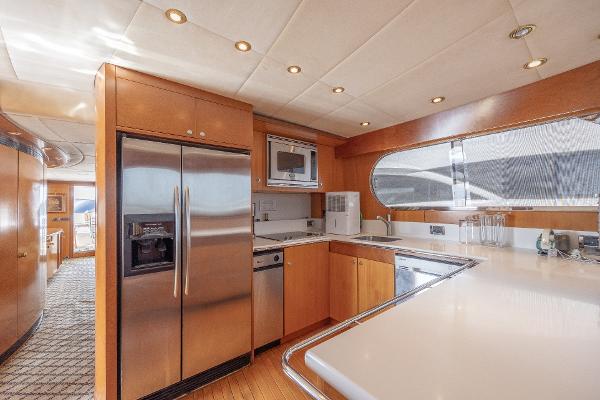 Luxurious kitchen in 2001 Grand Harbour 76 yacht with stainless steel appliances.