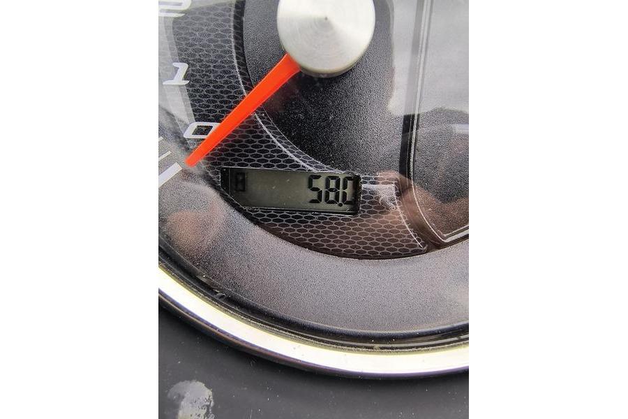 Close-up of 2017 Manitou 25 Oasis SE speedometer displaying 58.0 hours.