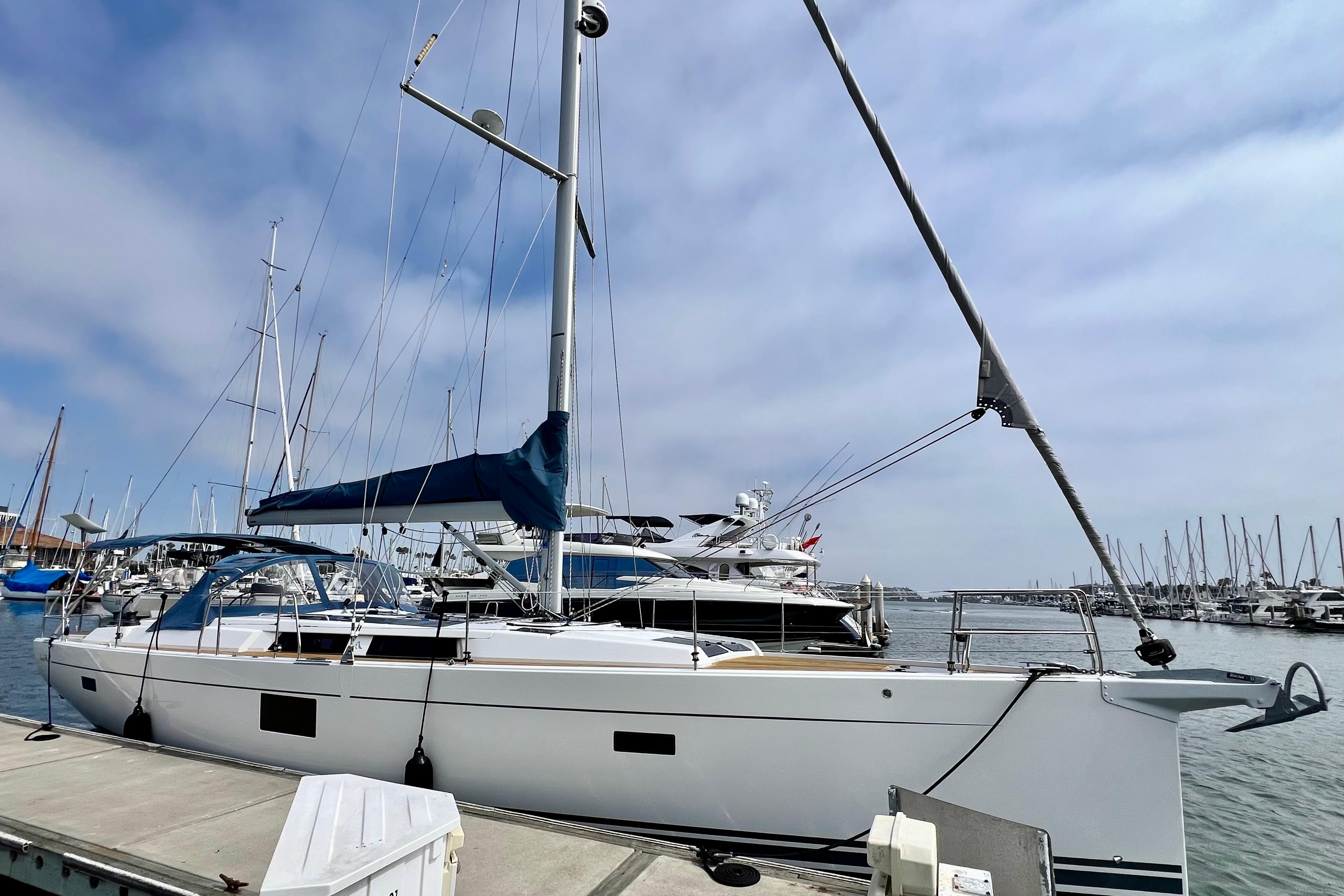 2016 Hanse 455 sailboat docked at marina under a partly cloudy sky.