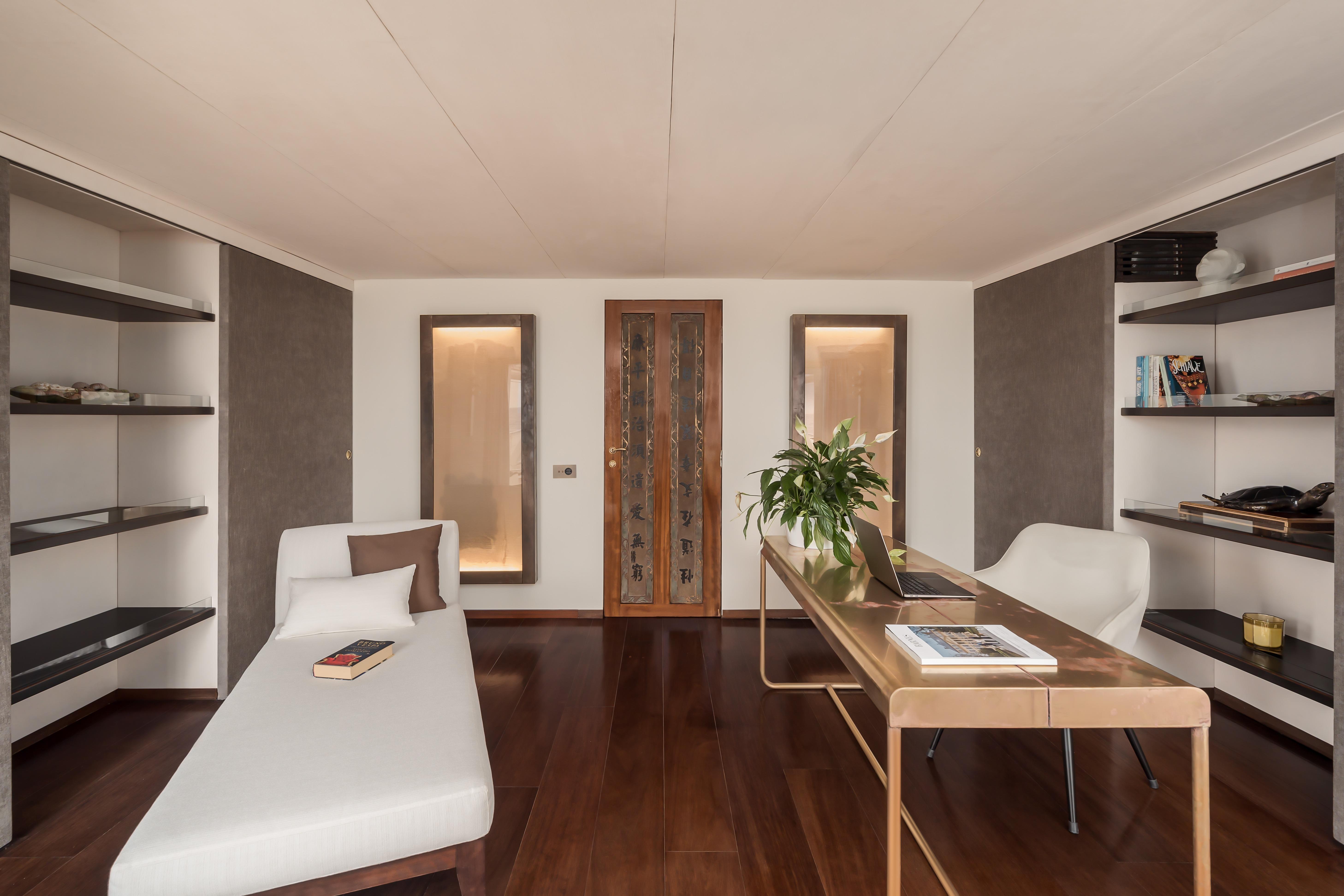 Modern interior of a 1956 custom converted tugboat with elegant furnishings and wooden flooring.