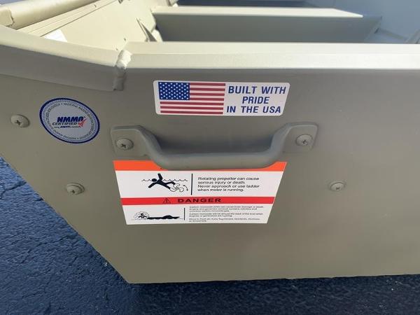 2024 Lowe L1040 Jon boat with safety warning and "Built with Pride in the USA" sticker.