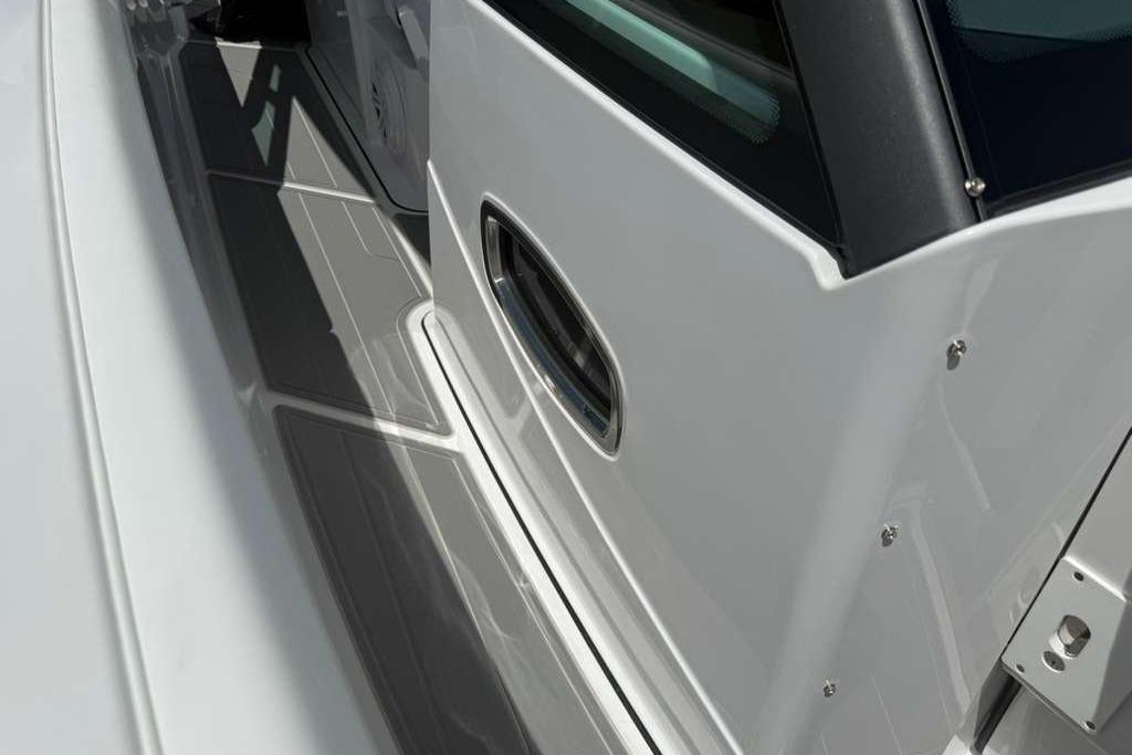 2026 Monterey Elite 30 OB boat deck with sleek white and gray design.
