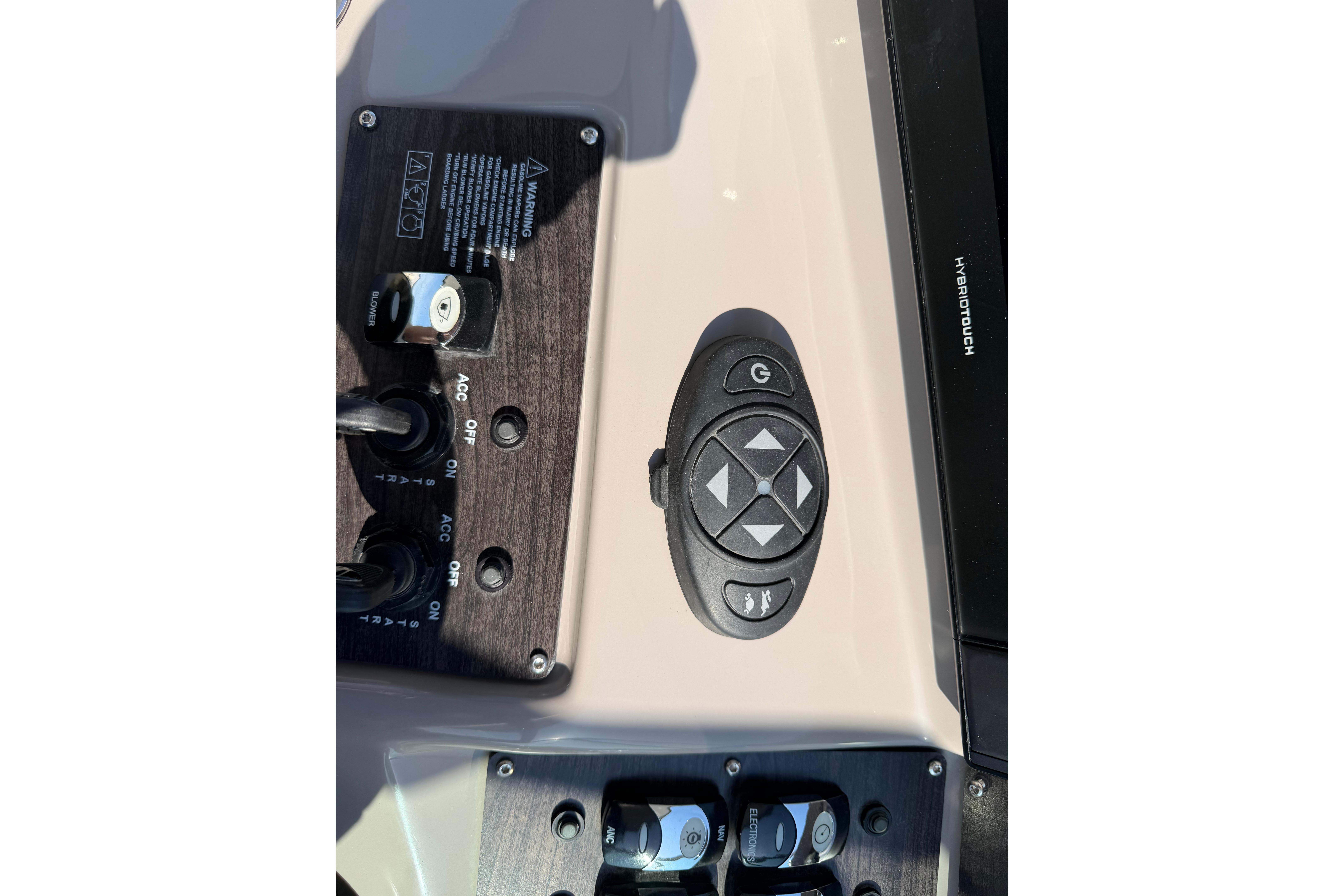 Control panel of 2019 Rinker EX 320 boat with buttons and switches.