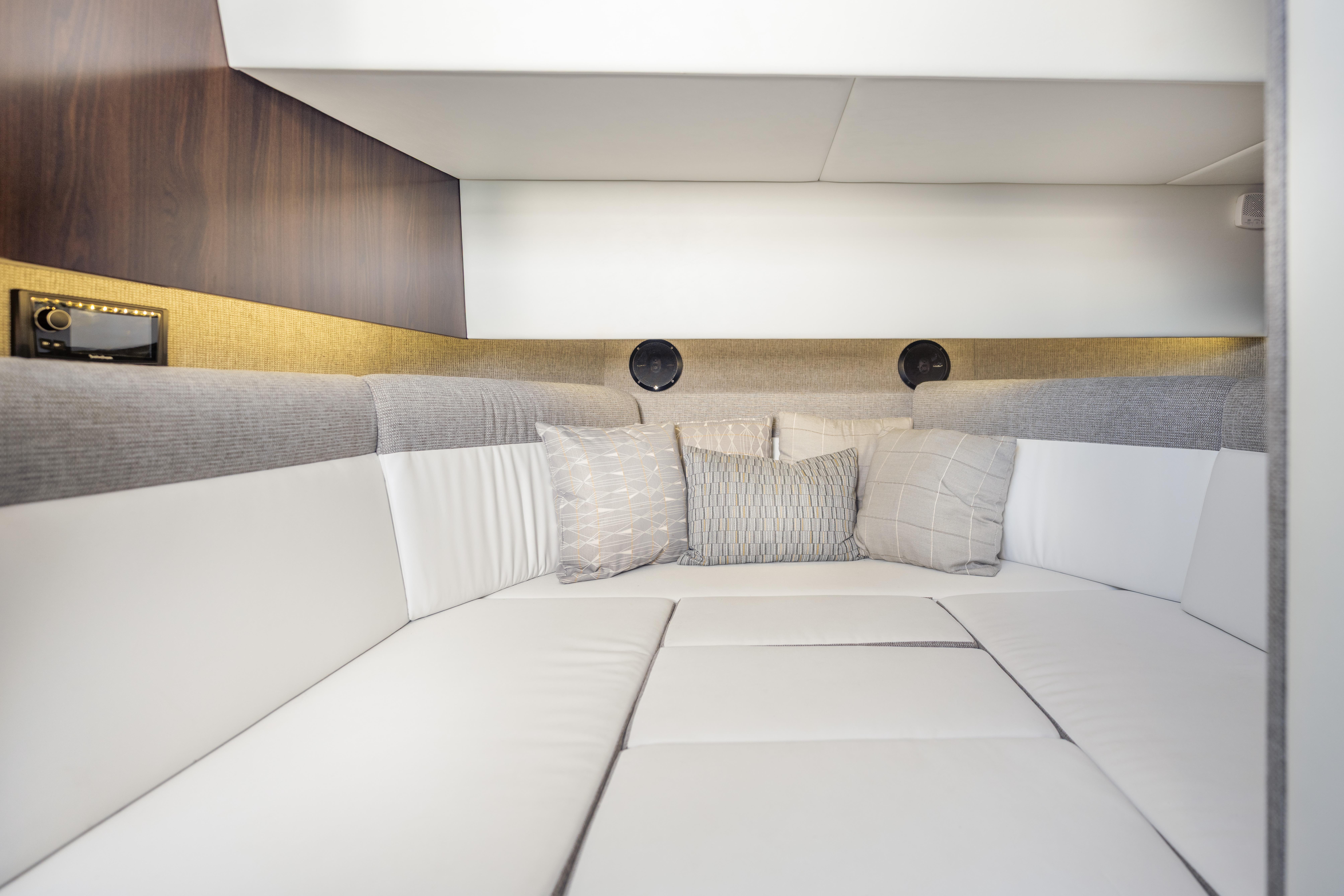 Interior cabin of 2021 Cruisers Yachts 38 GLS with modern seating and cushions.