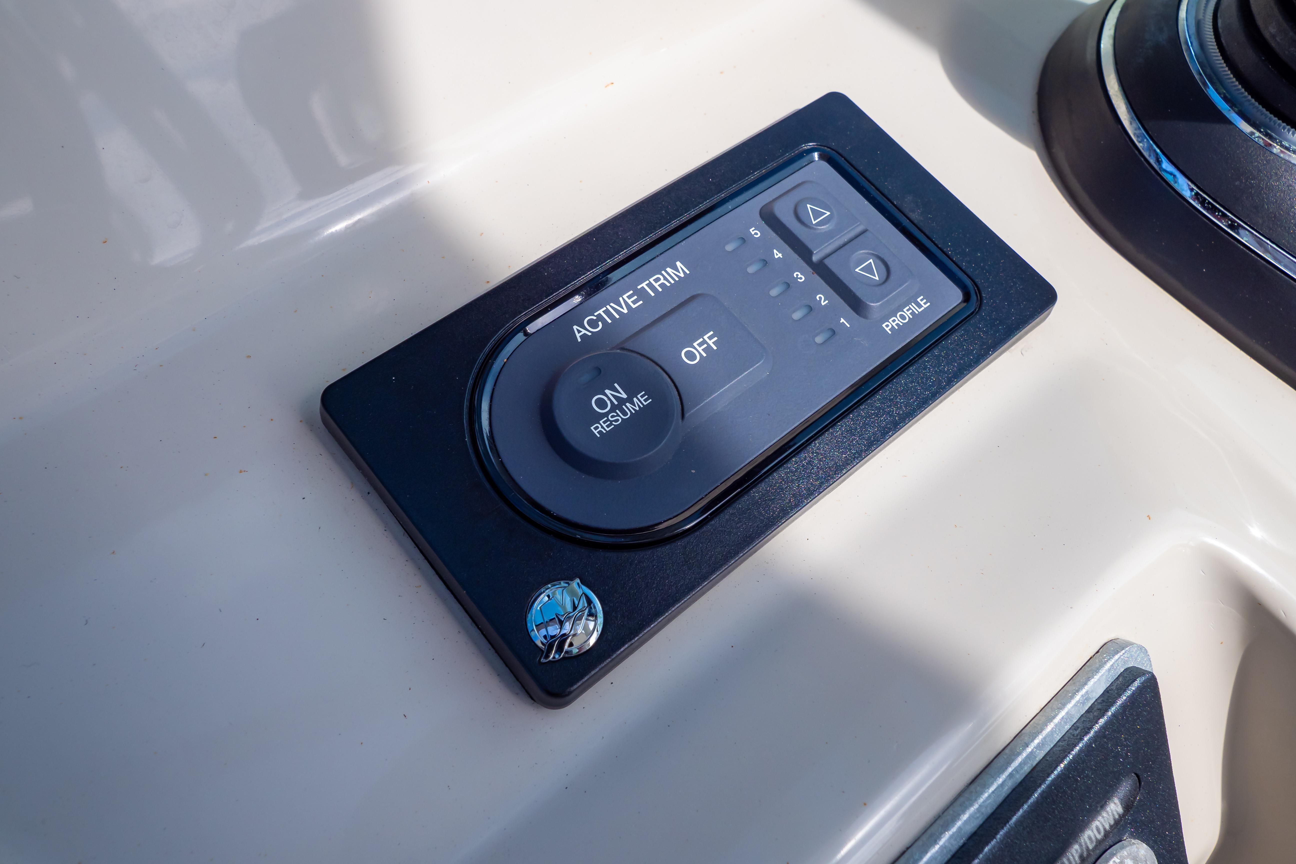 Active trim control panel on 2019 Boston Whaler 270 Vantage boat dashboard.