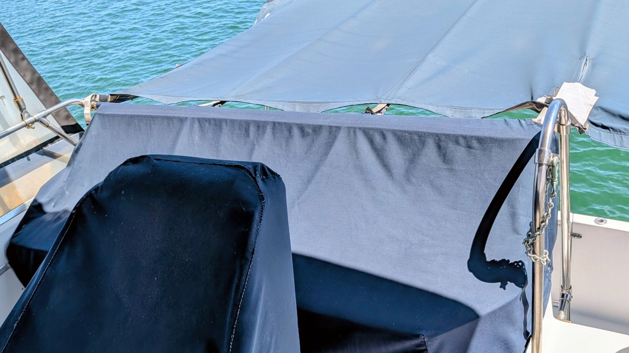 The image shows the cockpit of a 1987 Chris-Craft 320 Amerosport Express with blue covers.