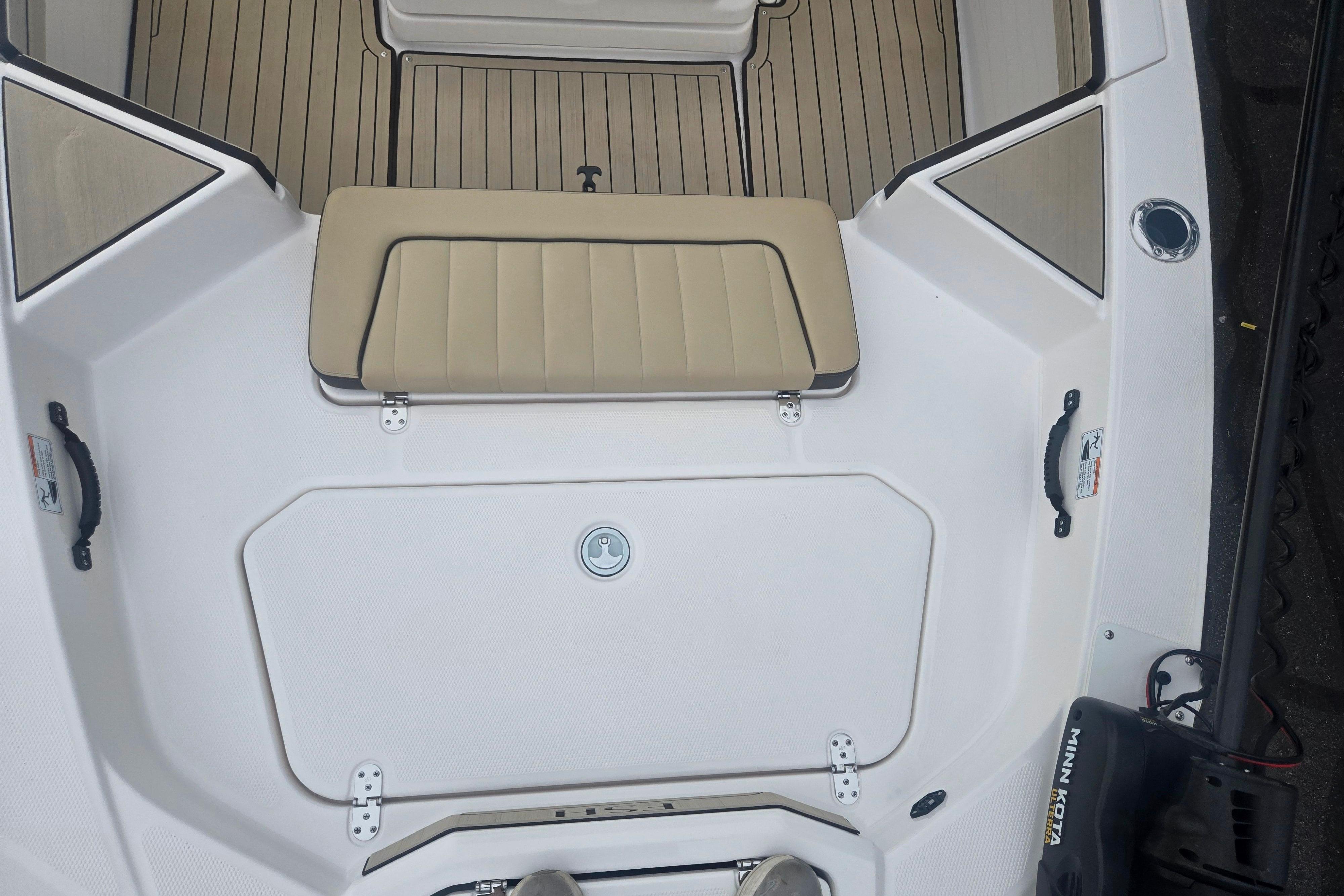 2022 Yamaha Boats 195 FSH Sport interior with beige seating and deck details.