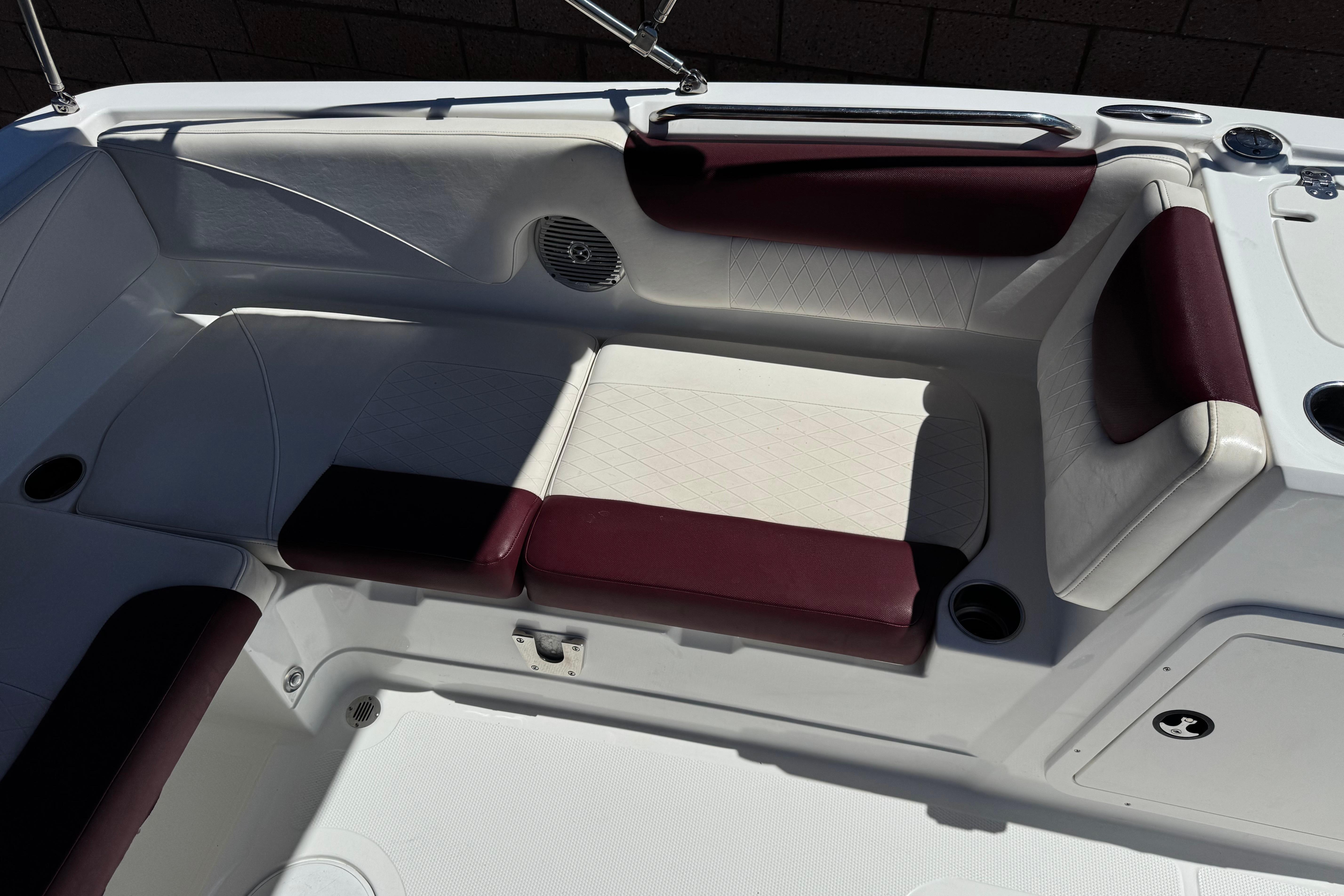 Interior seating of a 2017 Tahoe 2150 boat with maroon and white upholstery.