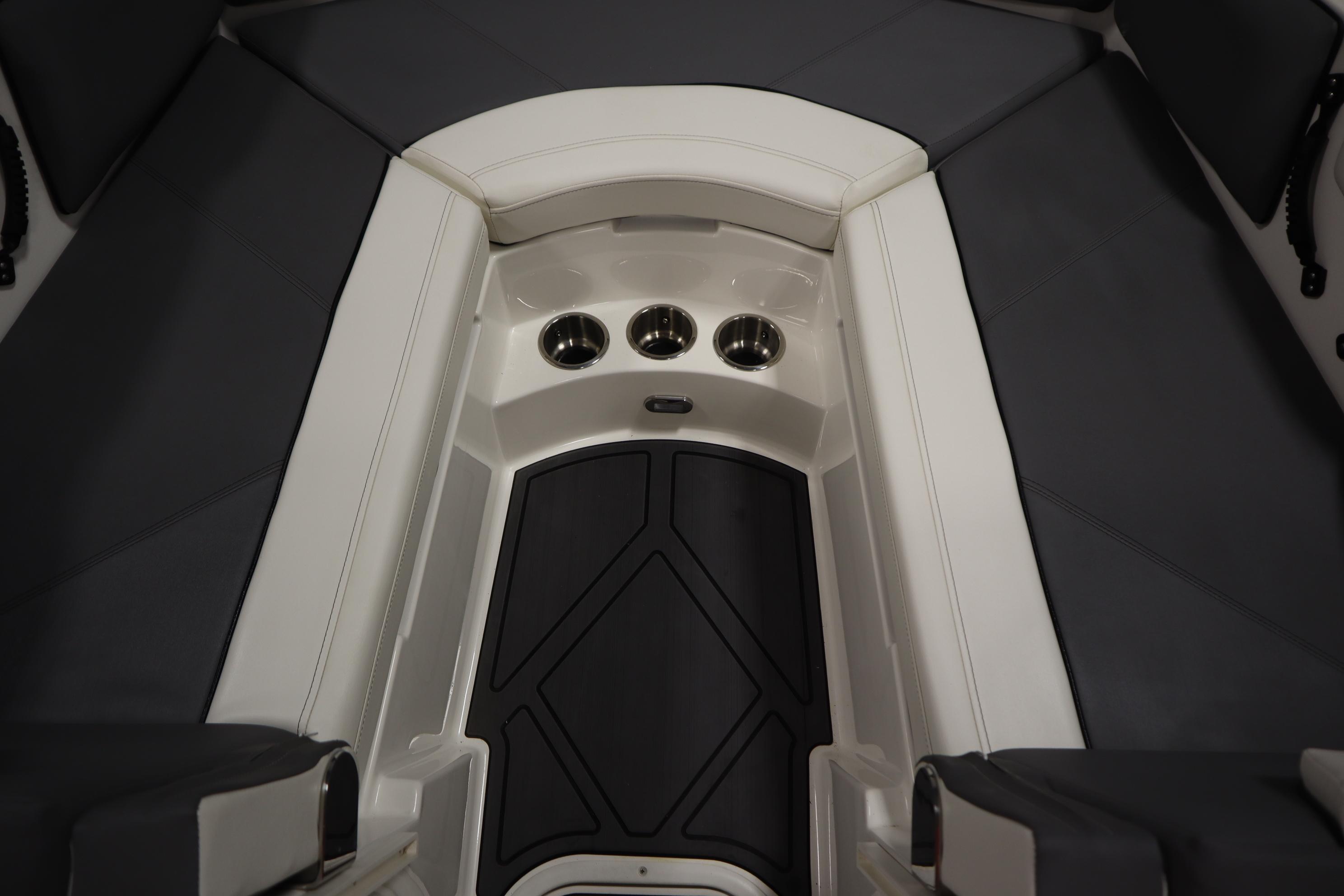 2023 Heyday WT Surf boat interior with cushioned seating and cup holders.