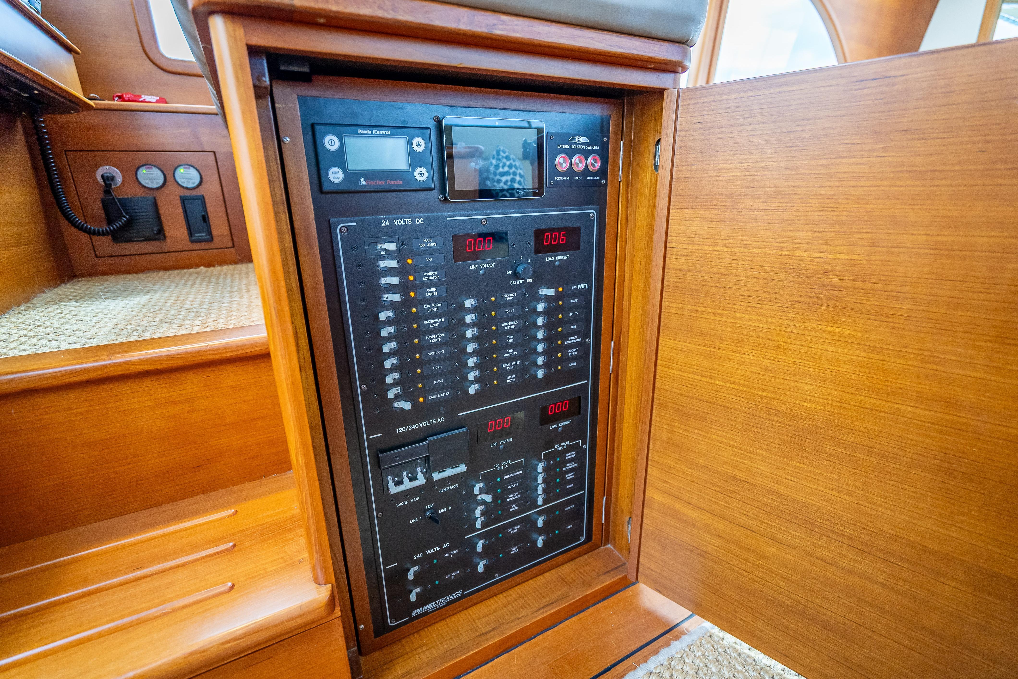 Electrical panel inside 2018 Palm Beach Motor Yachts PB50, showcasing control switches and meters.