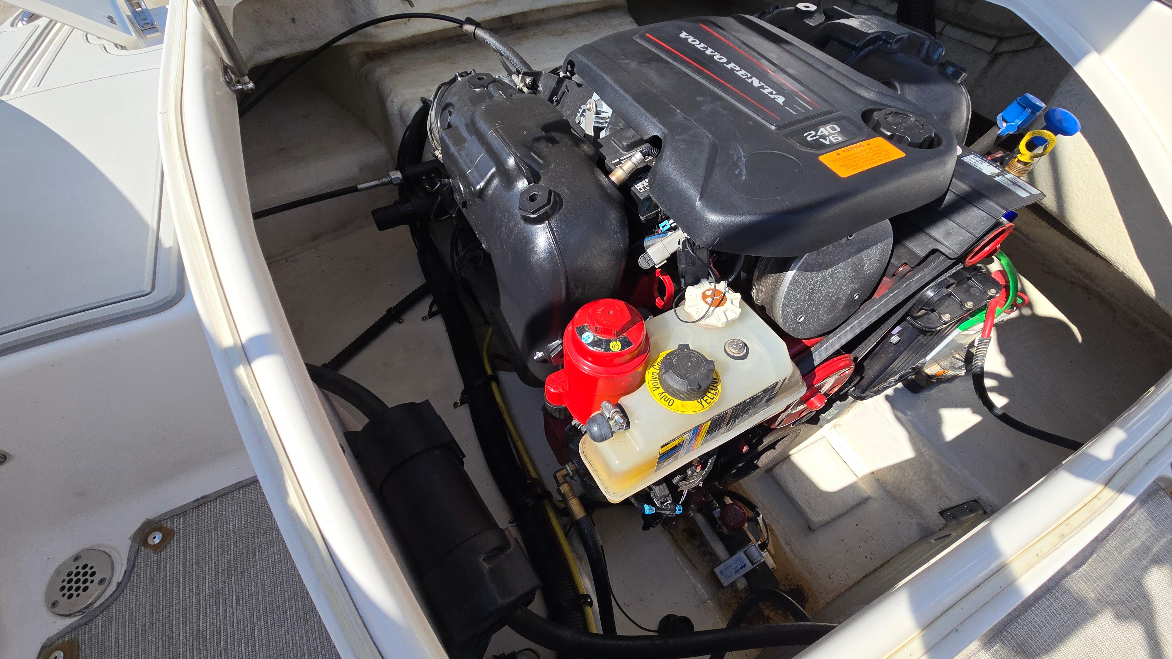 Engine compartment of 2018 Chaparral 224 Sunesta with Volvo Penta 240 V6 engine.