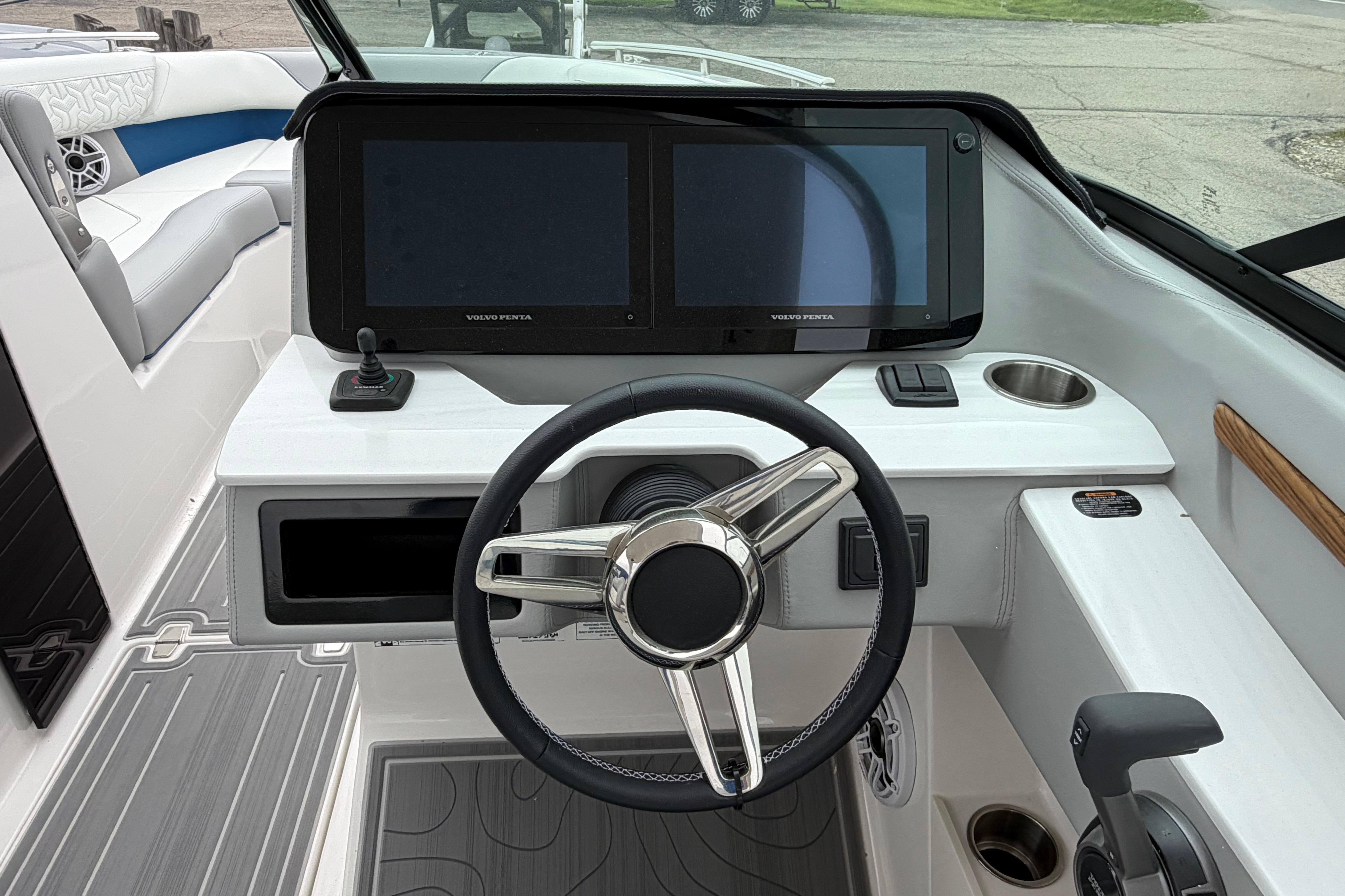 2026 Regal LS9 Surf boat dashboard with dual screens and steering wheel.
