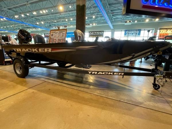 2025 Tracker Panfish 17 boat on display in showroom with trailer.
