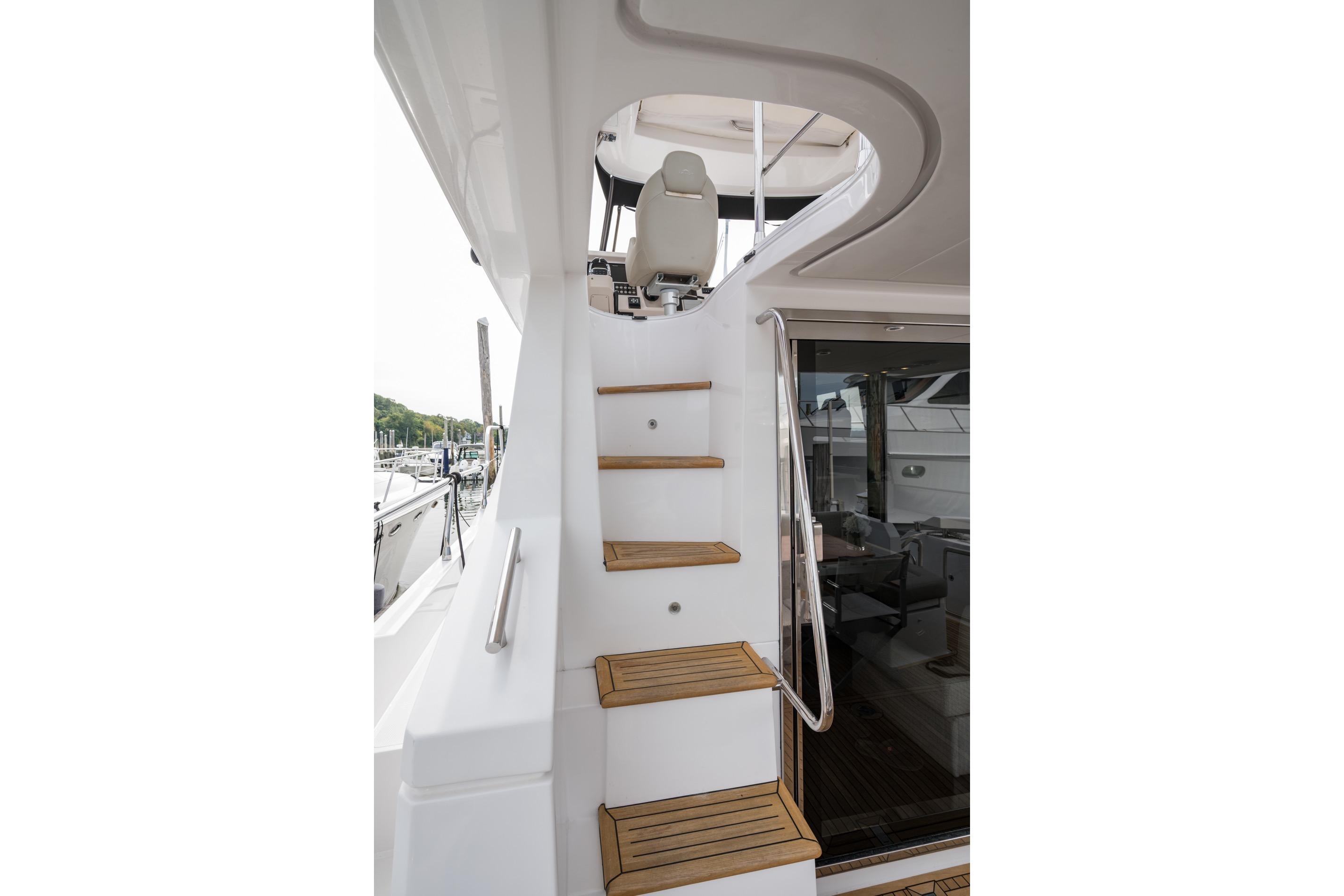 Staircase on 2020 Azimut Fly 50 yacht with wooden steps and sleek design.