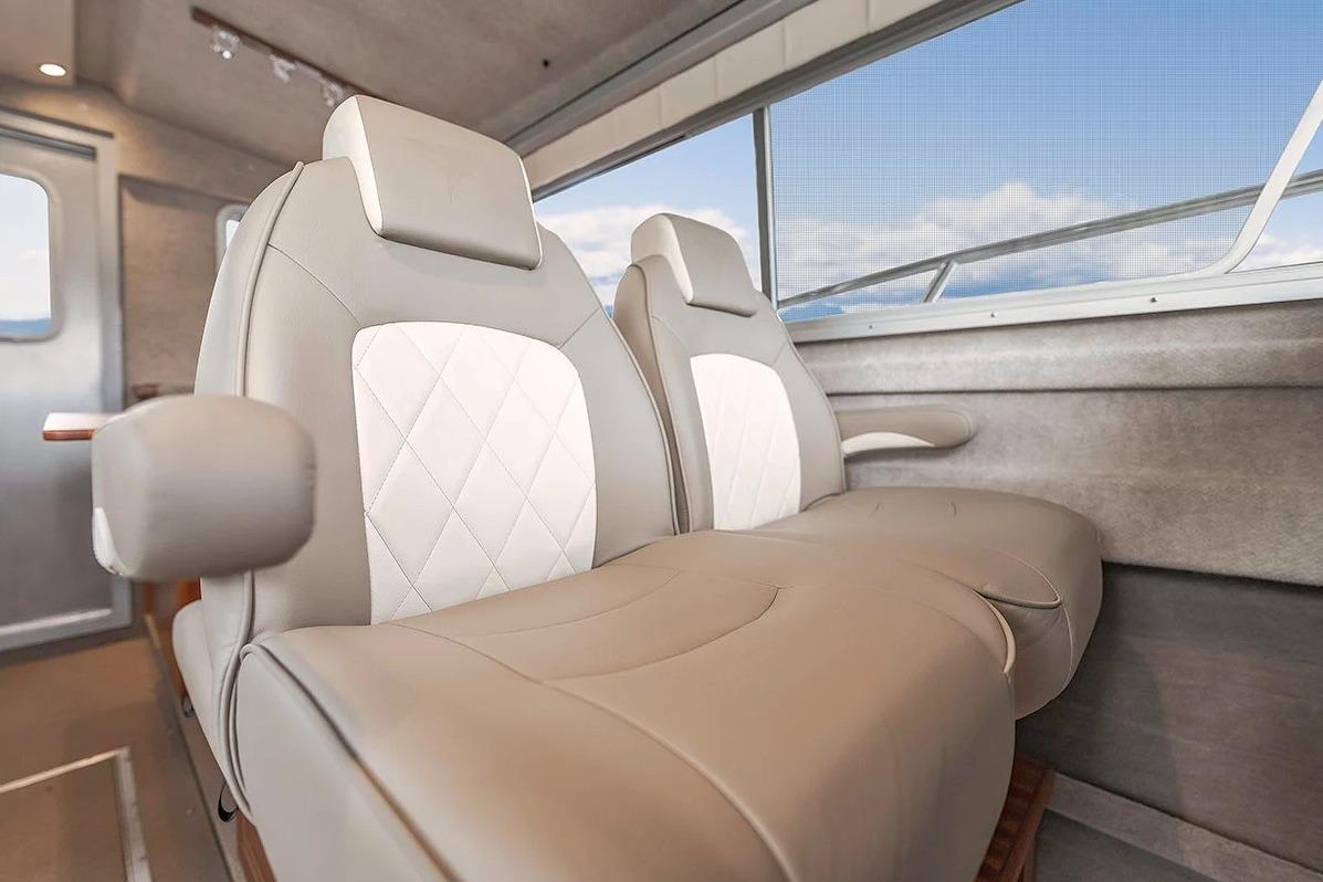 Luxurious interior seating of 2026 KingFisher 3225 GFX Offshore boat with elegant design.