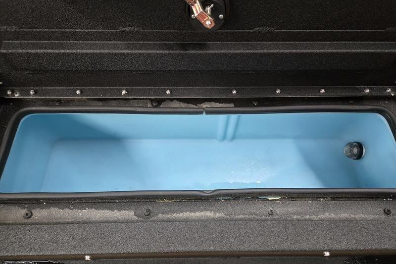 Open storage compartment of Avid 207 Recon 2026, featuring a blue interior.