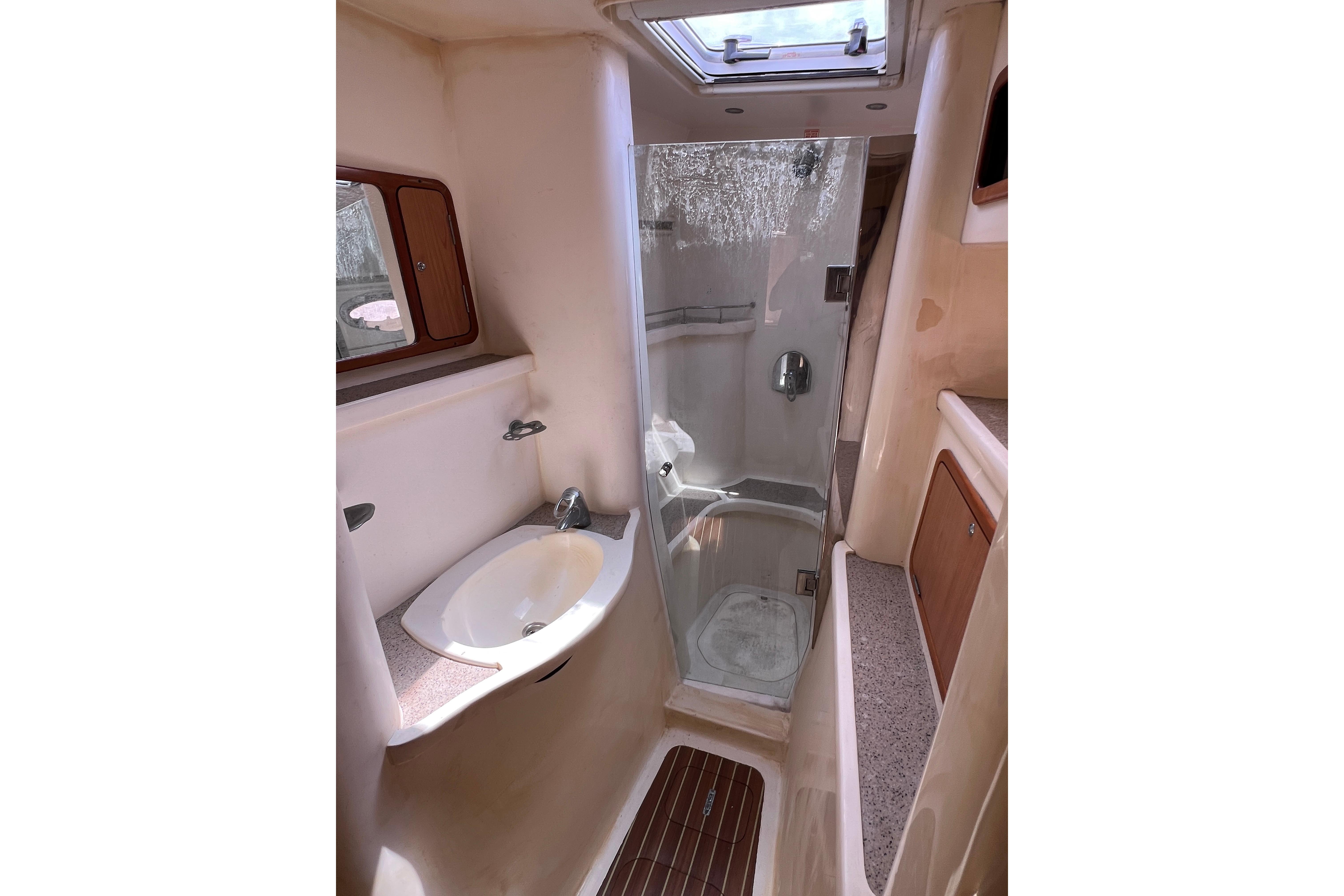 Luxurious bathroom interior of 2009 Africat Marine 420 yacht with shower and sink.