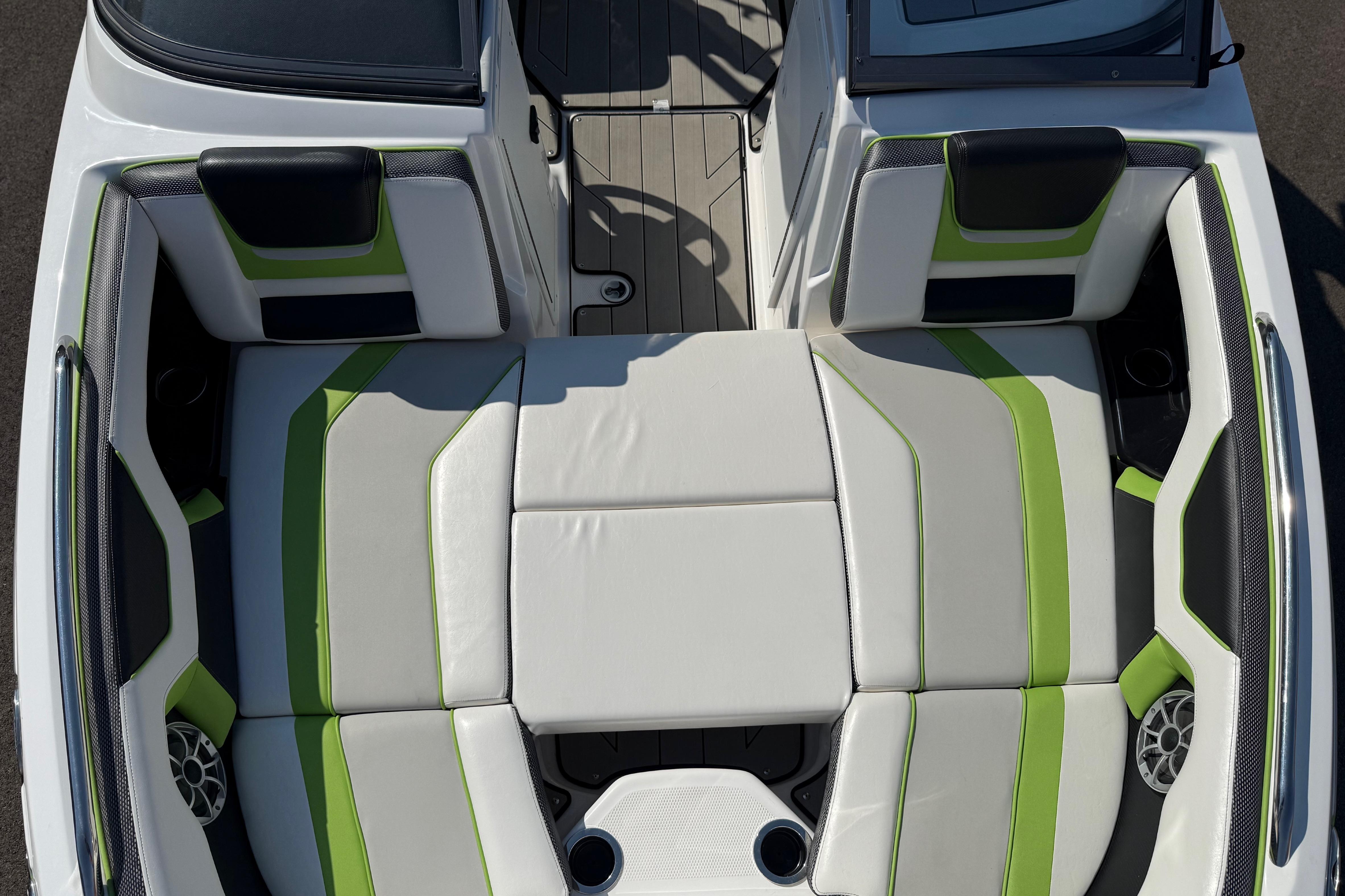 2022 Yamaha Boats 212XE interior with green and white seating, showcasing modern design.