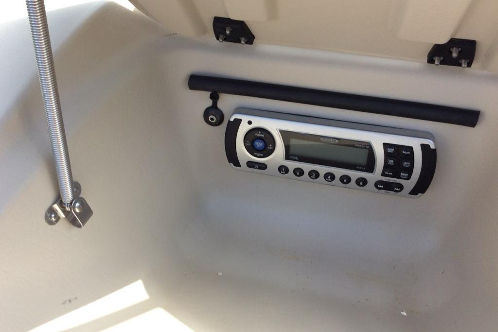 Boat stereo system inside a 2012 Glastron GT180 compartment.