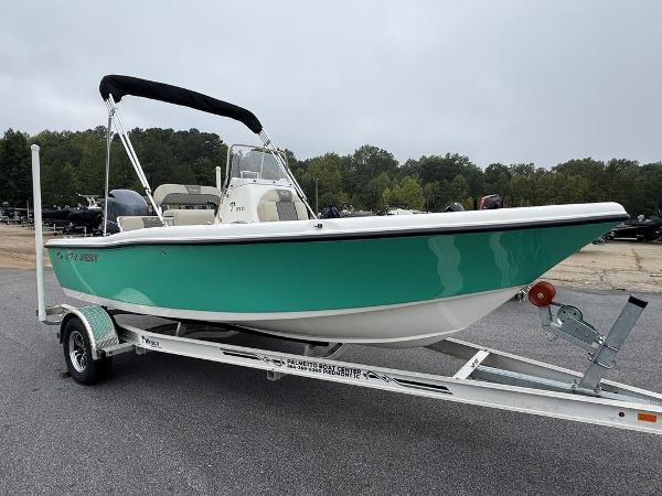 2025 Key West 179 FS boat on trailer, teal hull, parked outdoors.